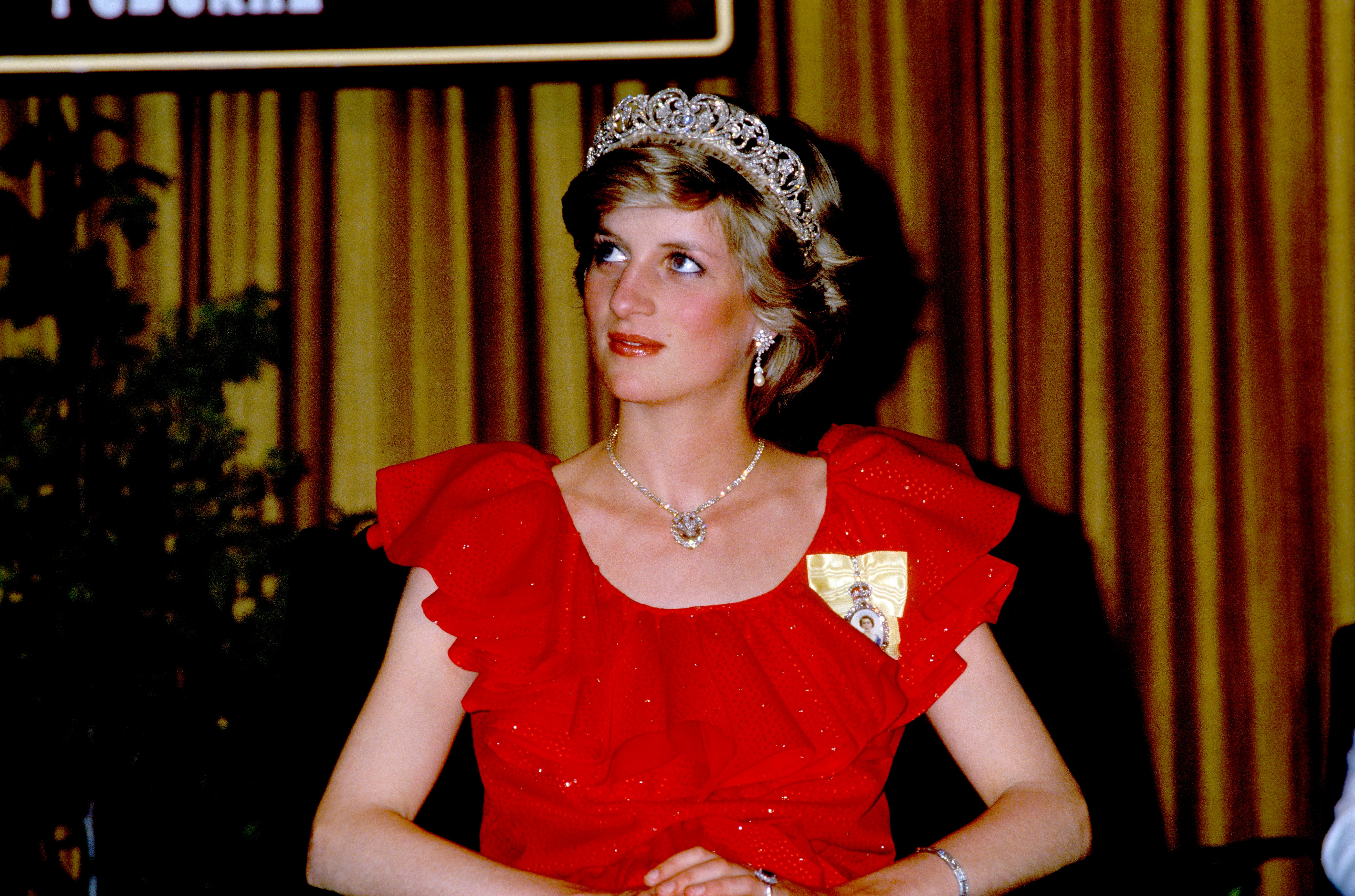 Princess Diana is wearing the Spencer family tiara and a dress by Bruce Oldfield on 30th March 1983 | Photo: Getty Images