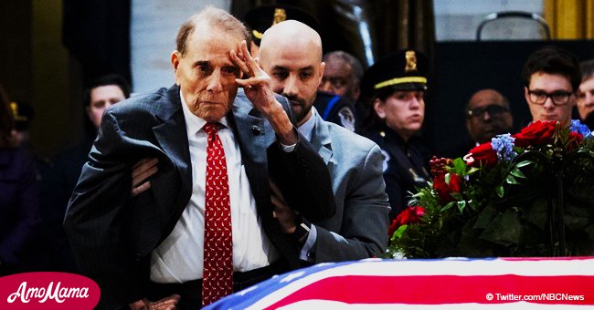 Former senator Bob Dole, 95, rose from a wheelchair to salute former president George H.W. Bush 