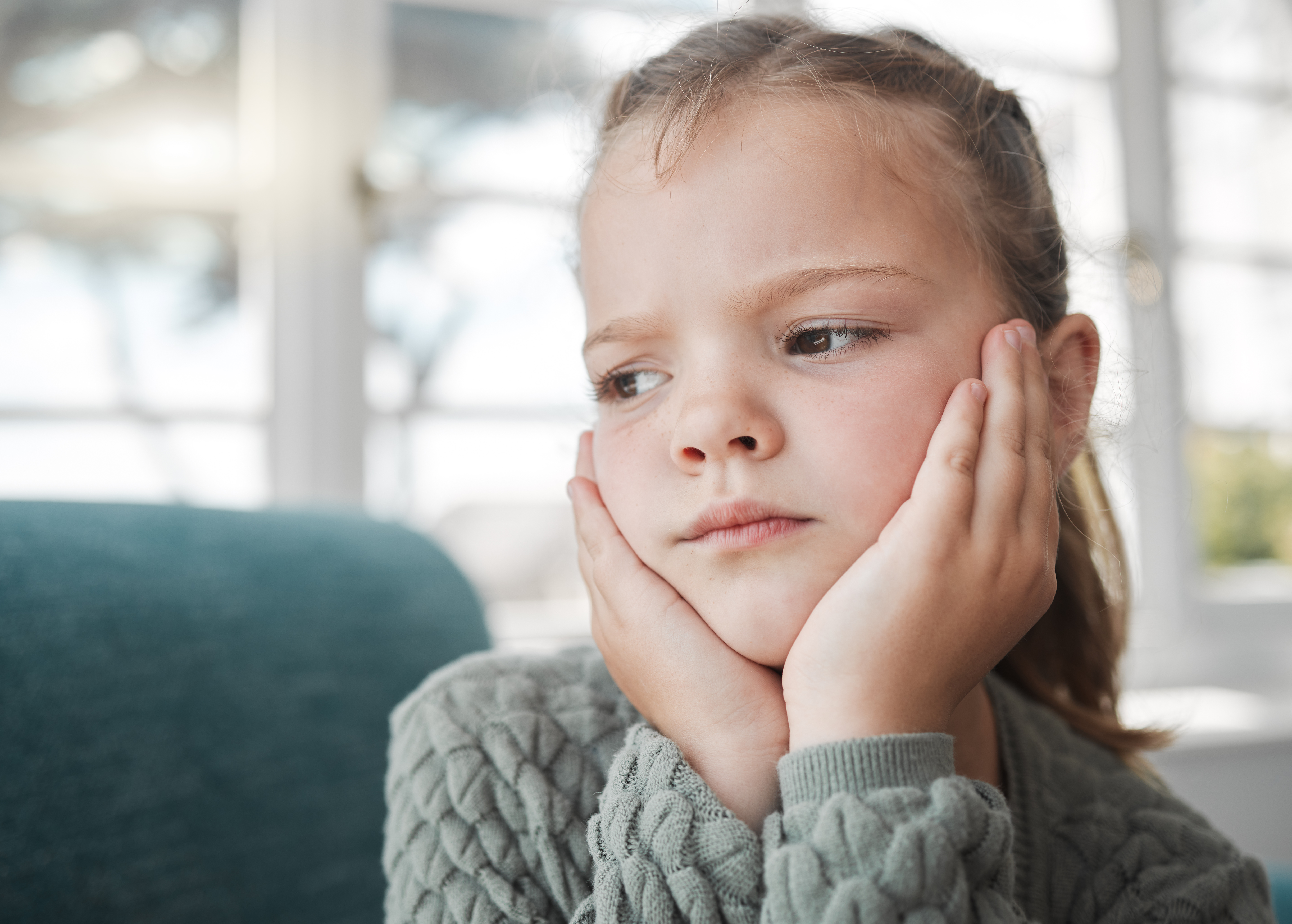 Shot of a young girl looking bored at home | Source: Getty Images