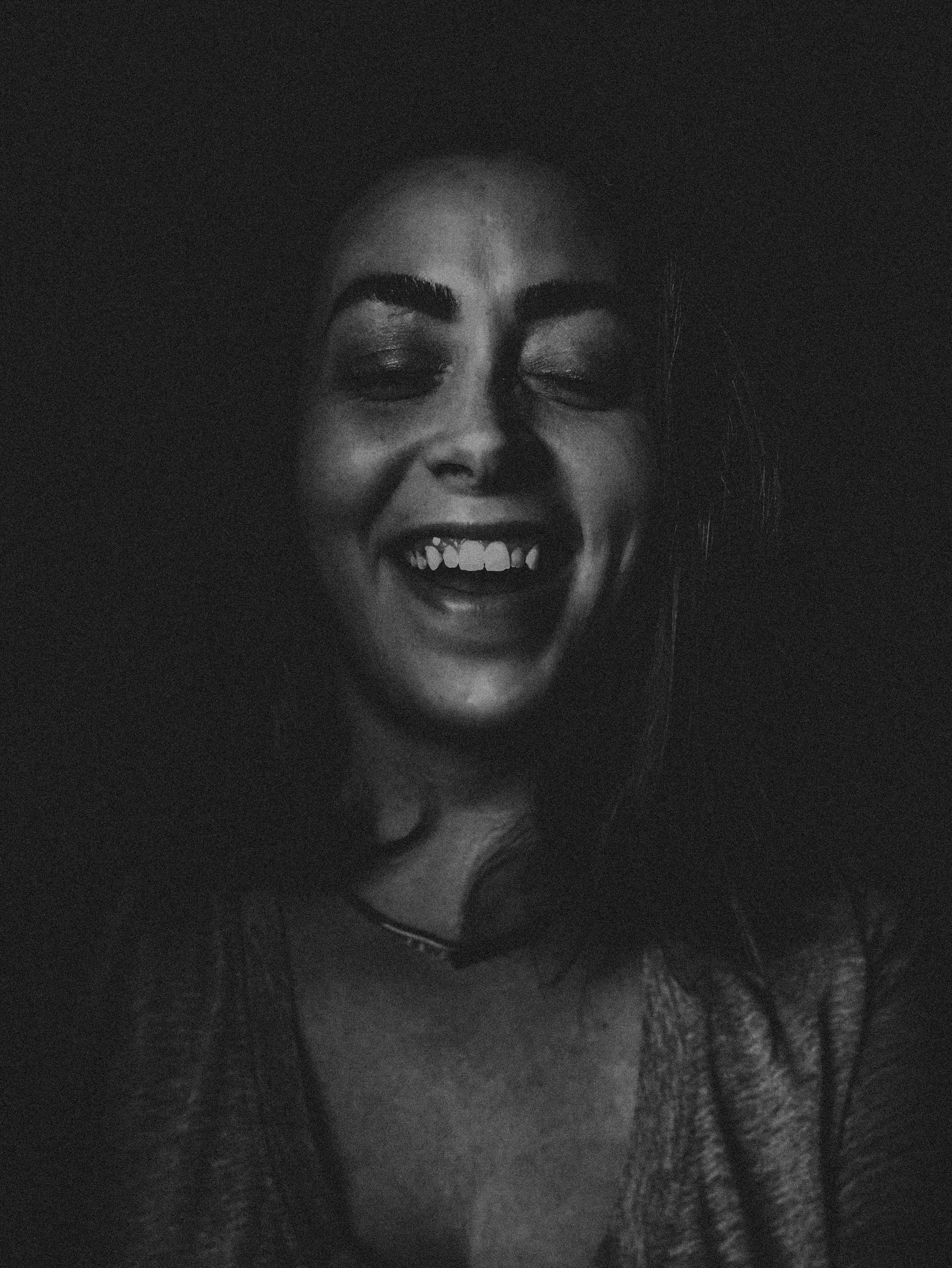 A woman laughing | Source: Unsplash
