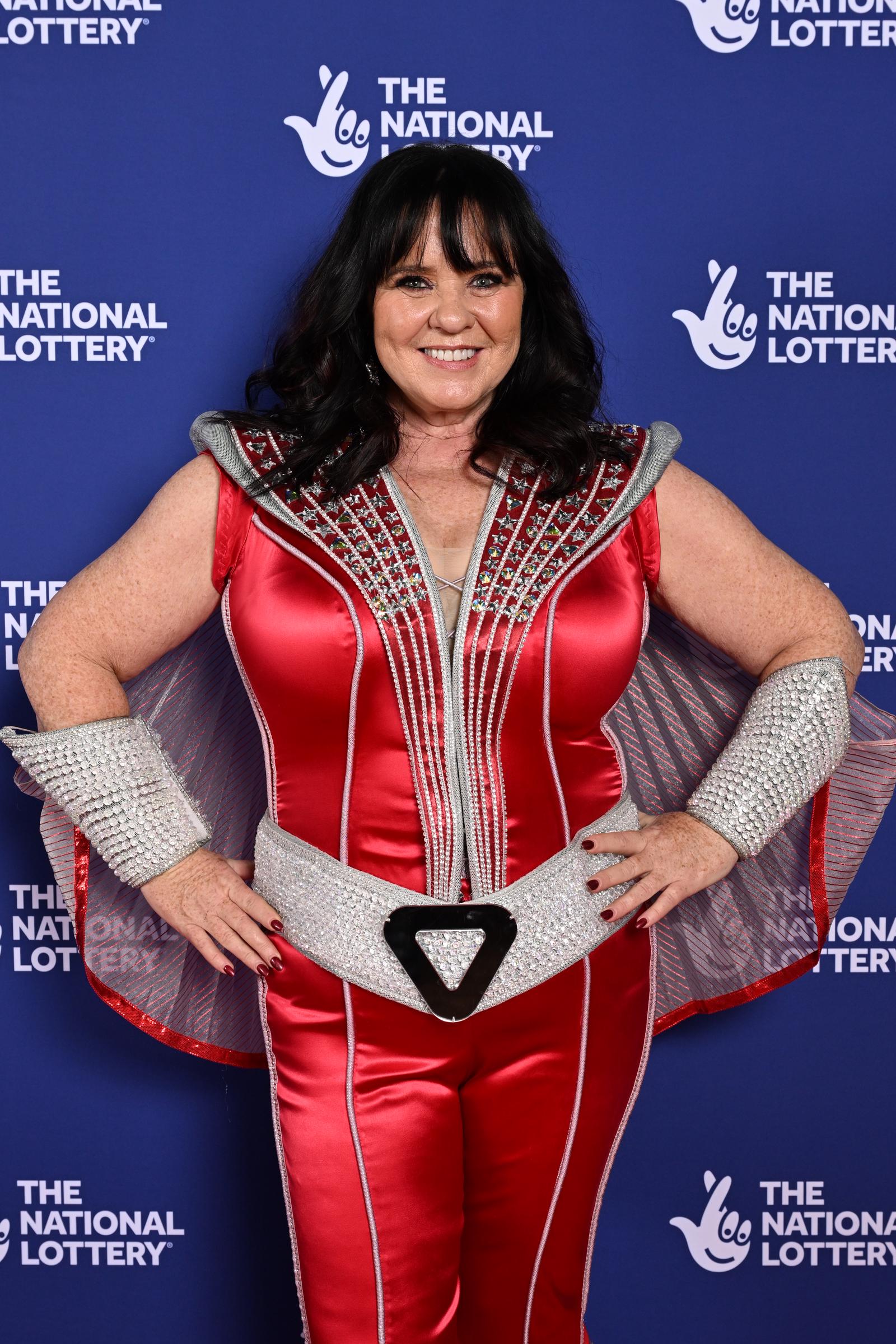 Nolan embraced festive flair at The National Lottery New Year's Eve Big Bash 2024 at OVO Arena Wembley on 4 December. She dazzled in a red satin jumpsuit with silver embellishments, structured shoulders, and a metallic belt — topped off with glittering cuffs and a flowing cape.