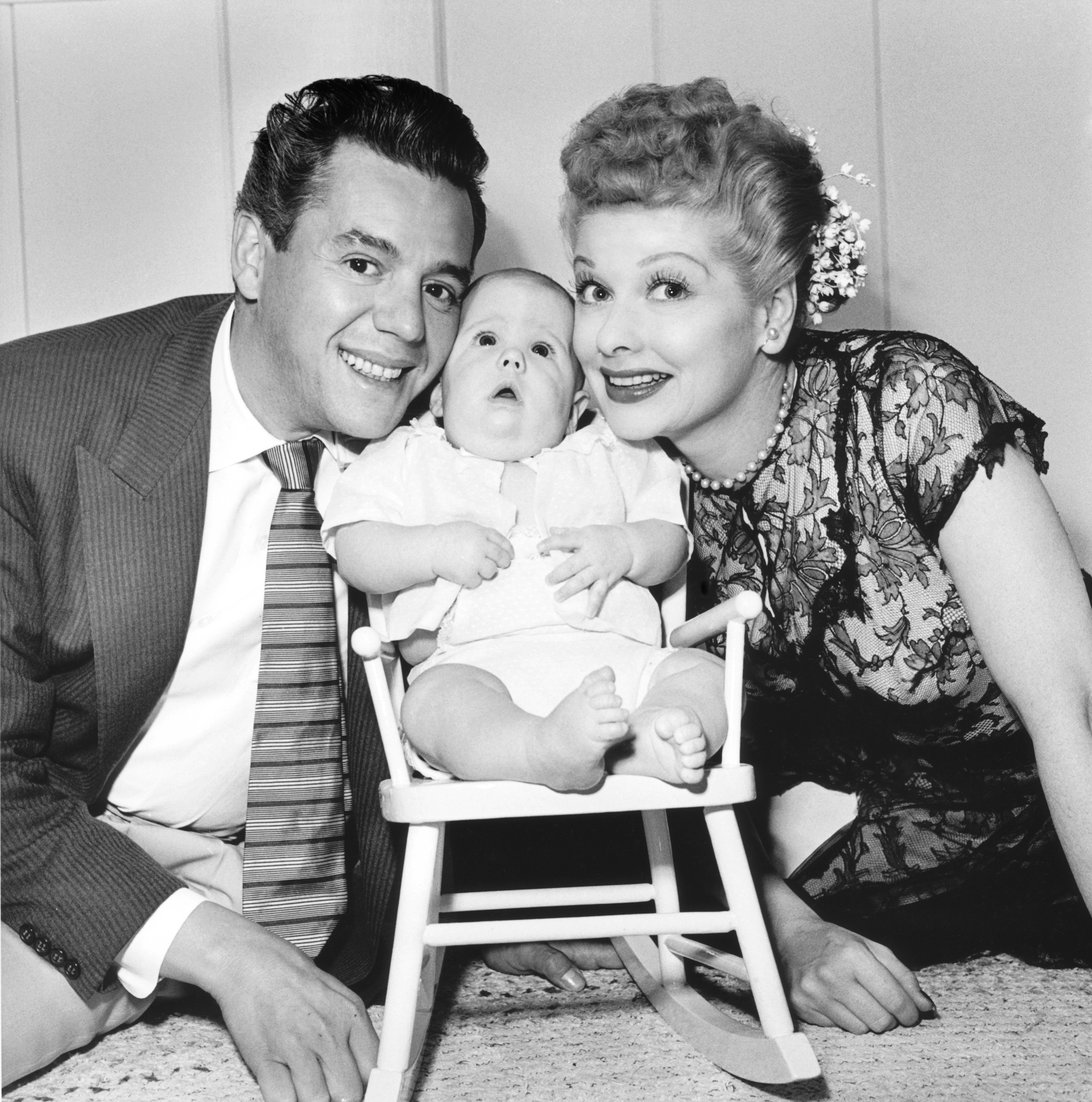 Lucille Ball, Desi Arnaz, and Desi Arnaz Jr. at their home in California in January 1953 | Source: Getty Images