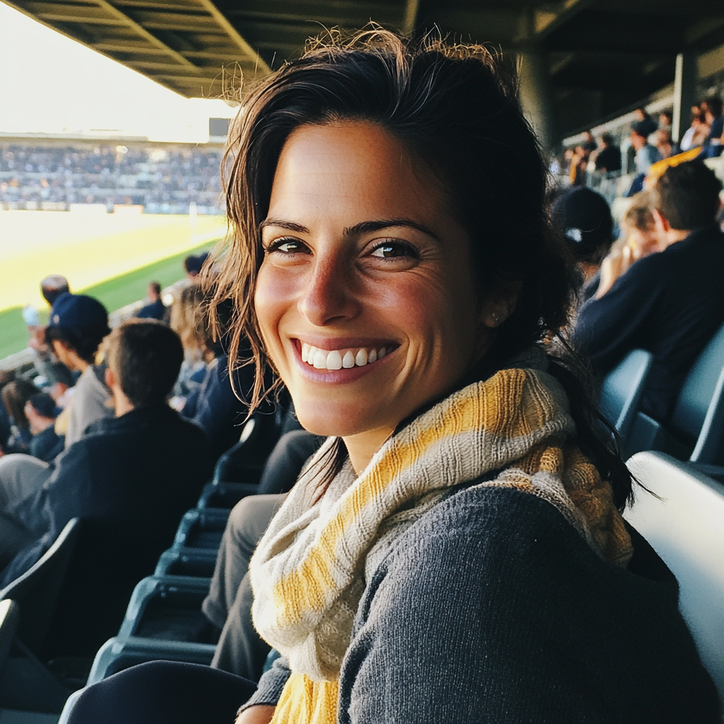 A woman sitting at a soccer game | Source: Midjourney