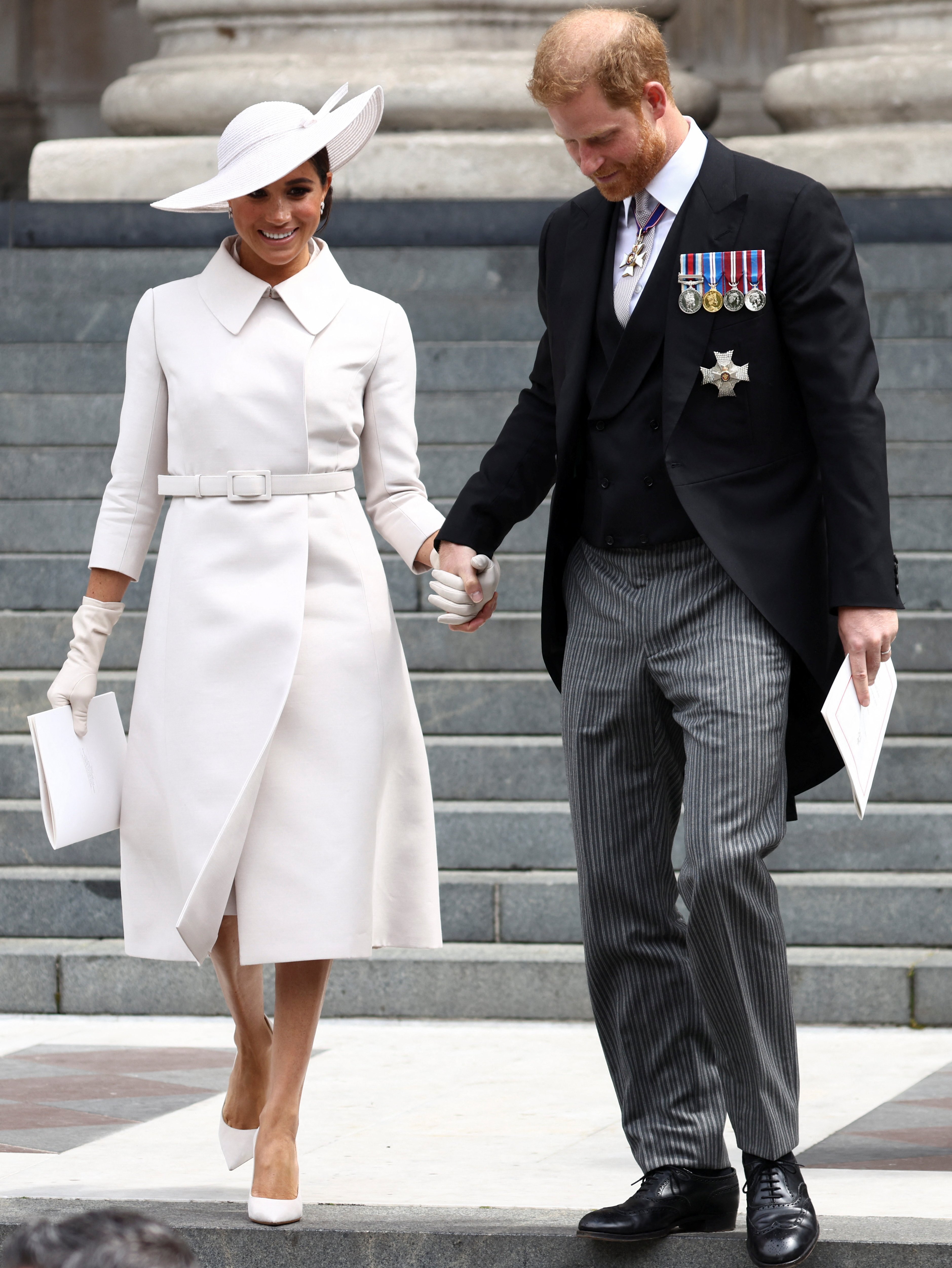 Meghan Markle, Duchess of Sussex and Prince Harry, Duke of Sussex pictured holding hands as they depart after the National Service of Thanksgiving at St Paul's Cathedral on June 3, 2022 in London, England. | Source: Getty Images