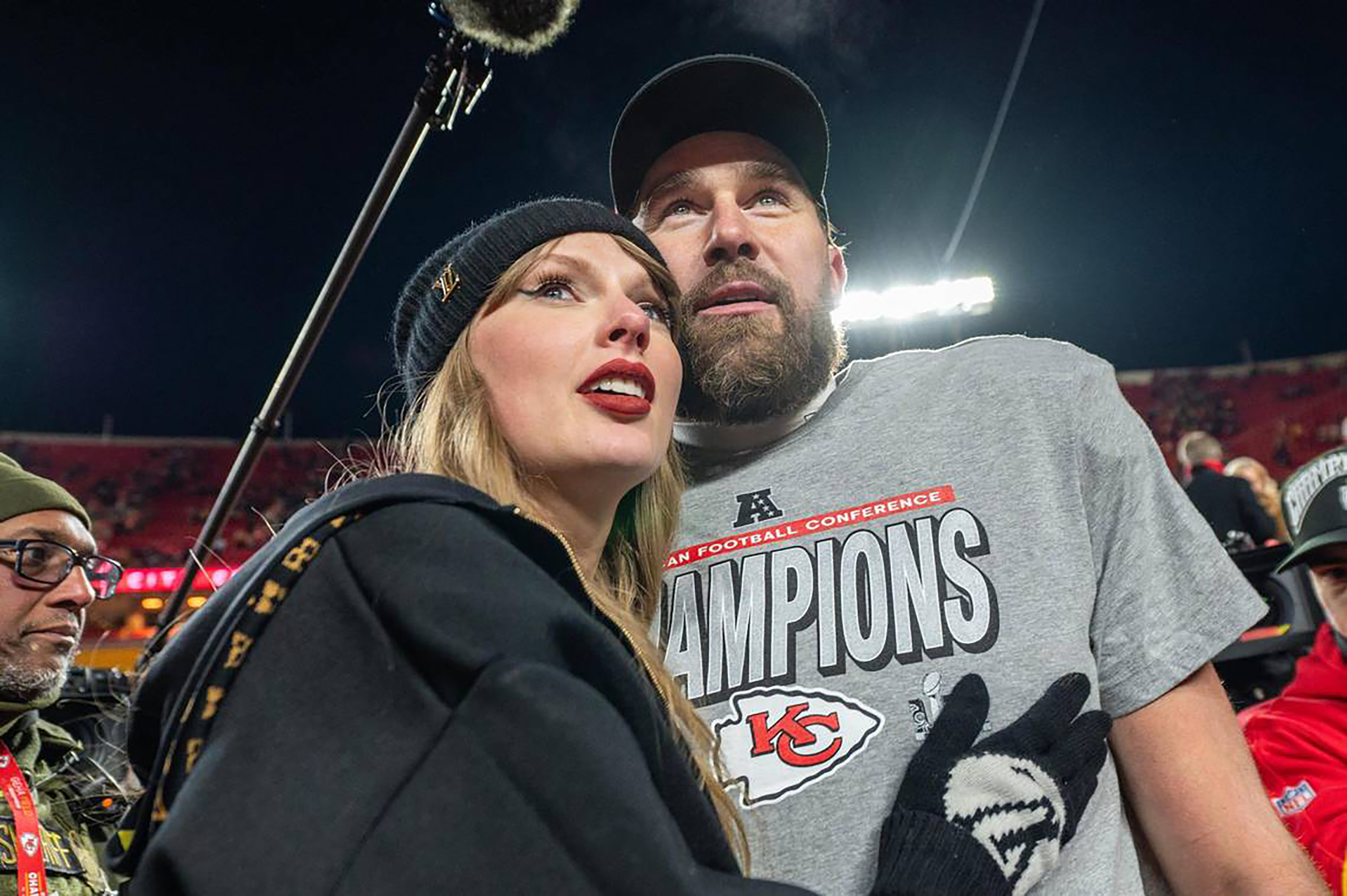 Taylor Swift and Kansas City Chiefs tight end Travis Kelce (87) walk off the field after the trophy ceremony following the Chiefs 32-29 victory over the Buffalo Bills in the AFC Championship Game on Sunday, January 26, 2025, at GEHA Field at Arrowhead Stadium. | Source: Getty Images