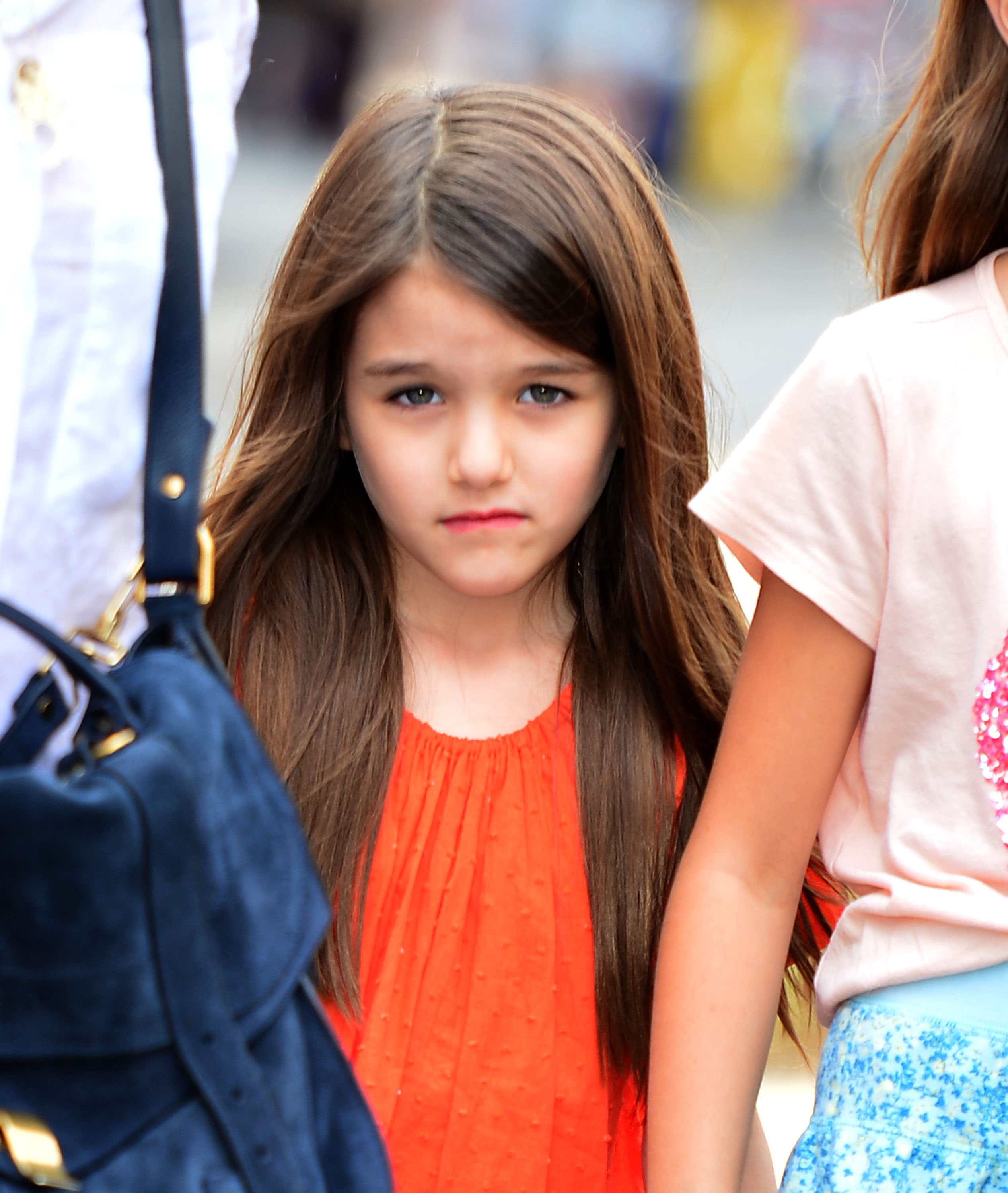 Suri Cruise visits a pet store in Manhattan on July 14, 2012 | Source: Getty Images