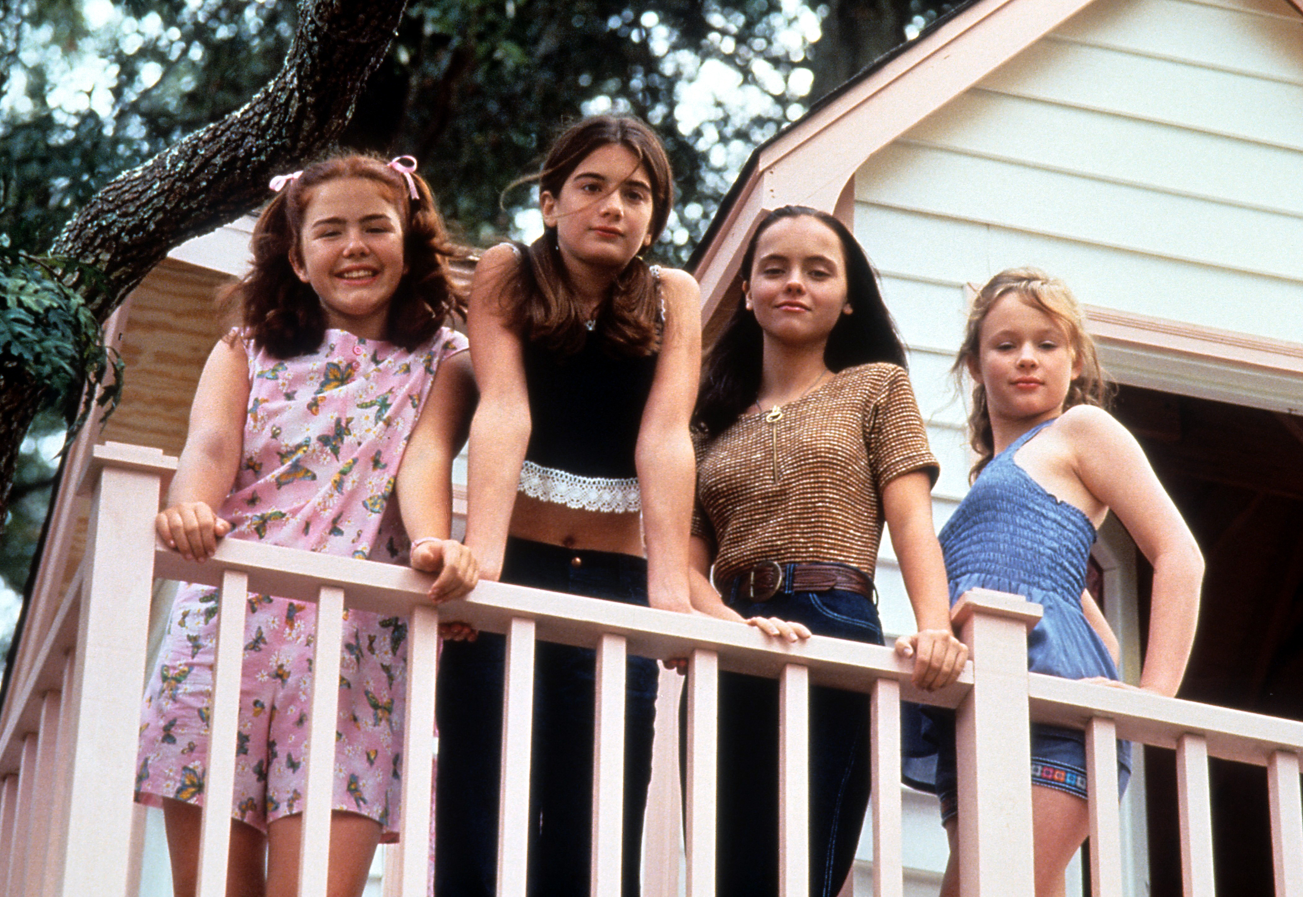 Ashleigh Aston Moore, Gaby Hoffmann, Christina Ricci and Thora Birch are pictured as they look over a balcony in a scene from the film, 'Now And Then', in 1995 | Source: Getty Images