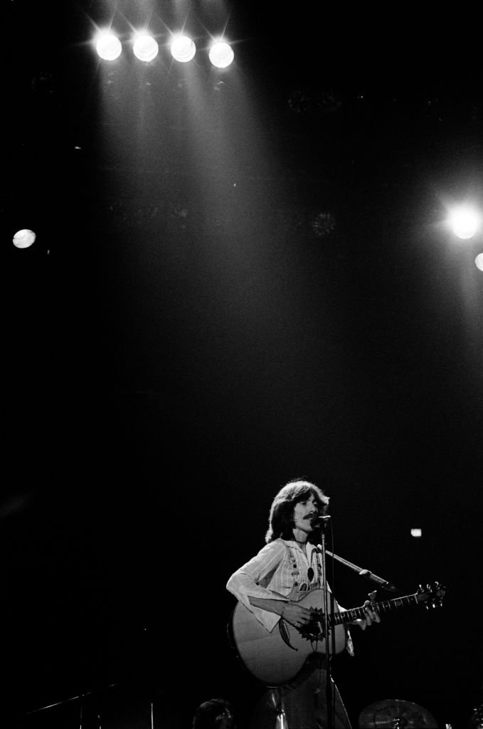 Singer/songwriter and former Beatles member, George Harrison (R)performs on stage during his "North American Tour" at the Capitol Center | Getty Images / Global Images Ukraine Singer/songwriter and former Beatles member, George Harrison (R)performs on stage during his "North American Tour" at the Capitol Center | Getty Images / Global Images Ukraine