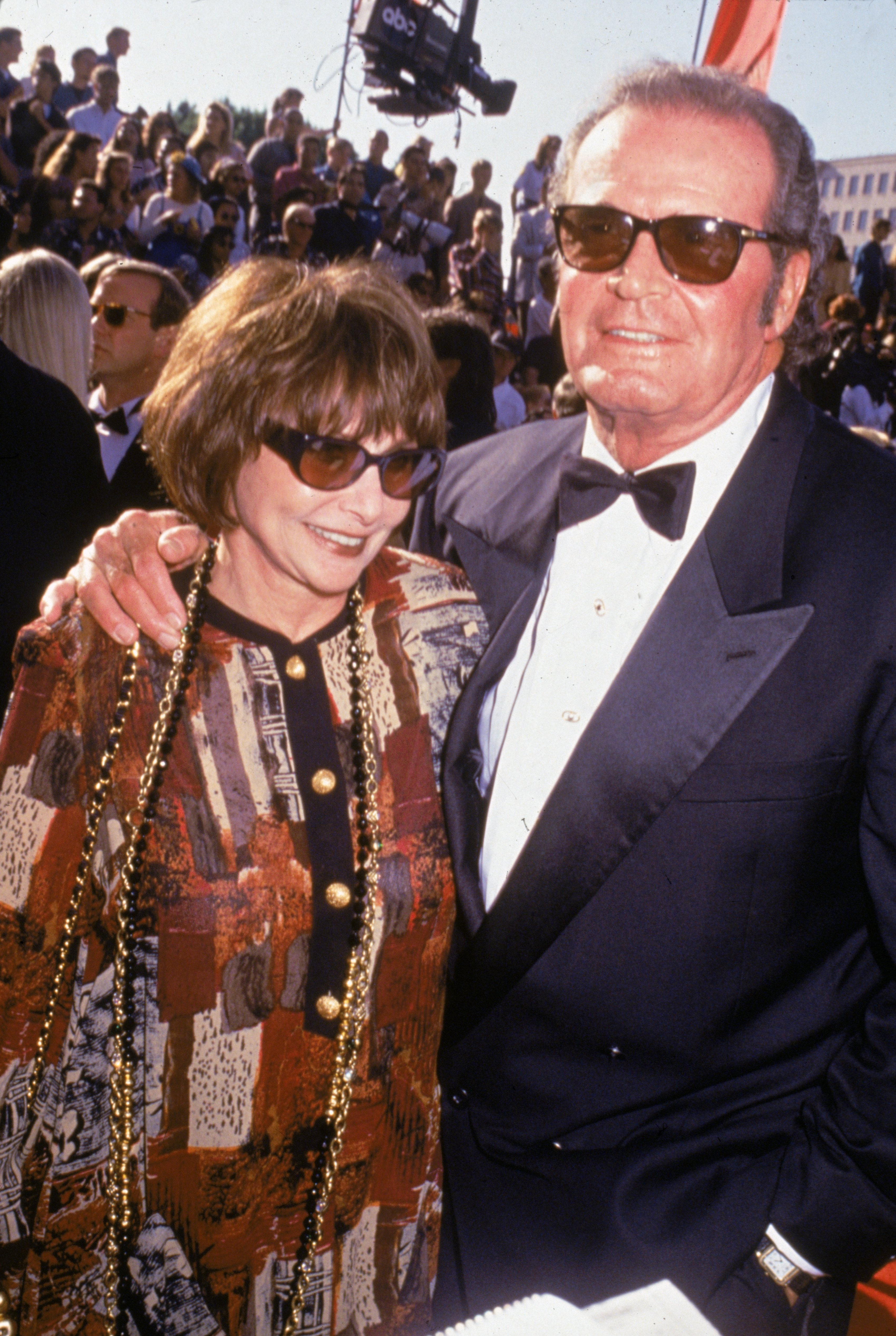 Circa 1995, American actor James Garner and his wife, Lois, stood outdoors in sunglasses in the 1990s. | Source: Getty Images