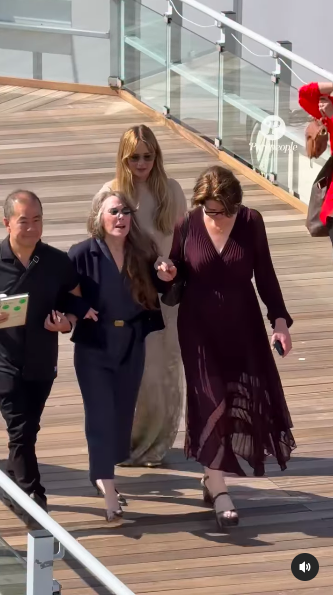 Sissy Spacek being guided by two people on either side of her, as Jennifer Lawrence walks behind them, posted on May 18, 2025. | Source: Instagram/purepeople