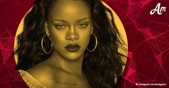 Rihanna exposes her ample cleavage in a tiny leather minidress, looking extremely busty