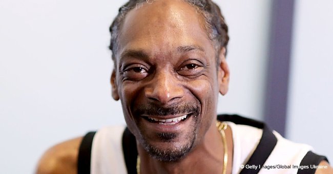 Snoop Dogg's newborn granddaughter sleeps peacefully in her father's arms in new photo