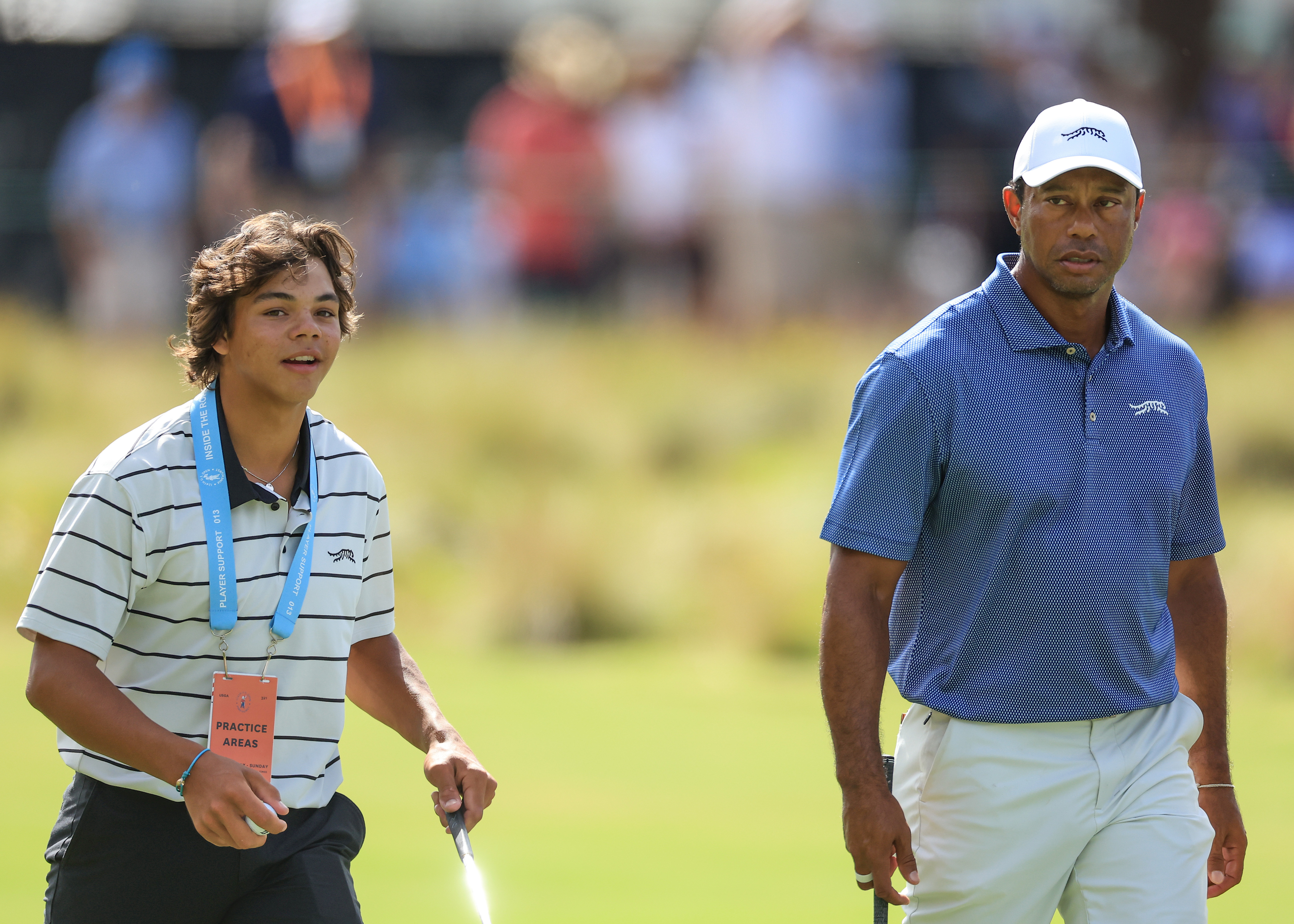 Tiger and Charlie Woods walk to practice for the 2024 U.S. Open in Pinehurst, North Carolina, on June 10, 2024 | Source: Getty Images