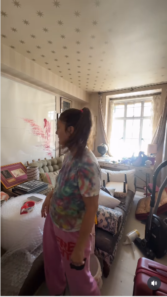 Drew Barrymore standing in her messy living while showcasing her home renovation project from a video posted on July 21, 2025 | Source: Instagram/drewbarrymore