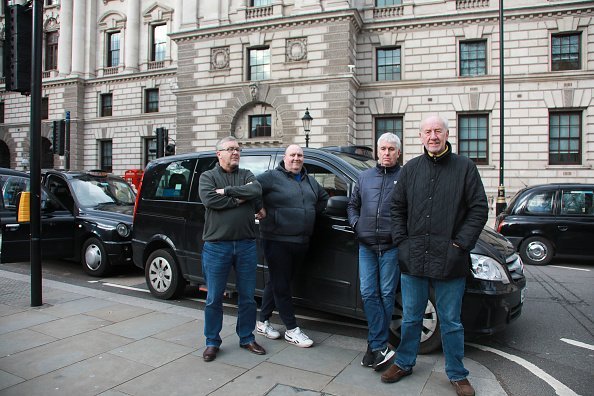 Photo of four men standing by a car | Image: Getty Images