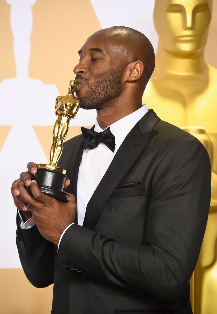 Kobe Bryant kisses his Oscar as he posed in the press room during the 90th Annual Academy Awards on March 4, 2018, in Hollywood, California | Source: Frazer Harrison/Getty Images