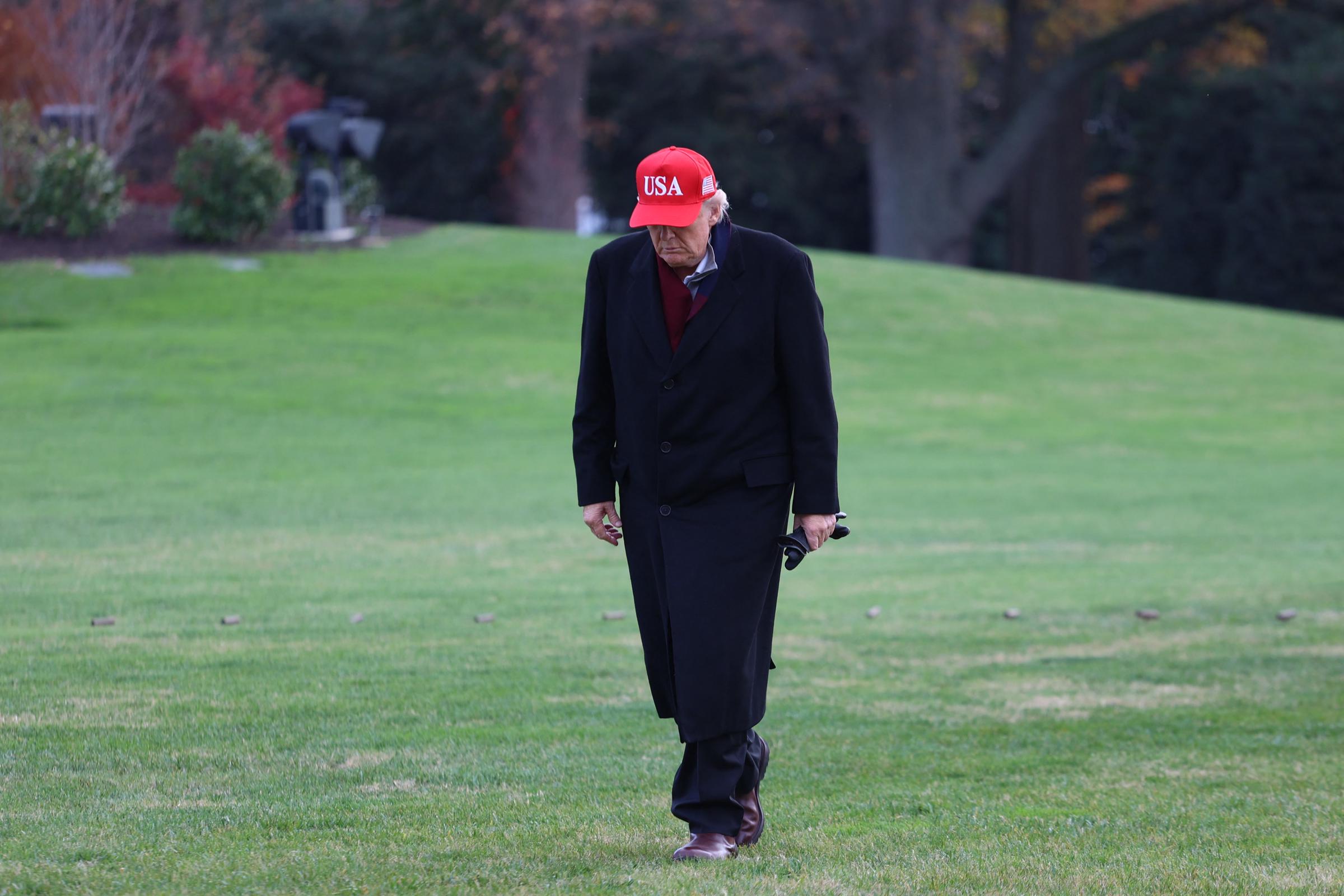 President Donald Trump is seen walking from Marine One to the White House after landing on the South Lawn in Washington, D.C., on November 22, 2025. | Source: Getty Images