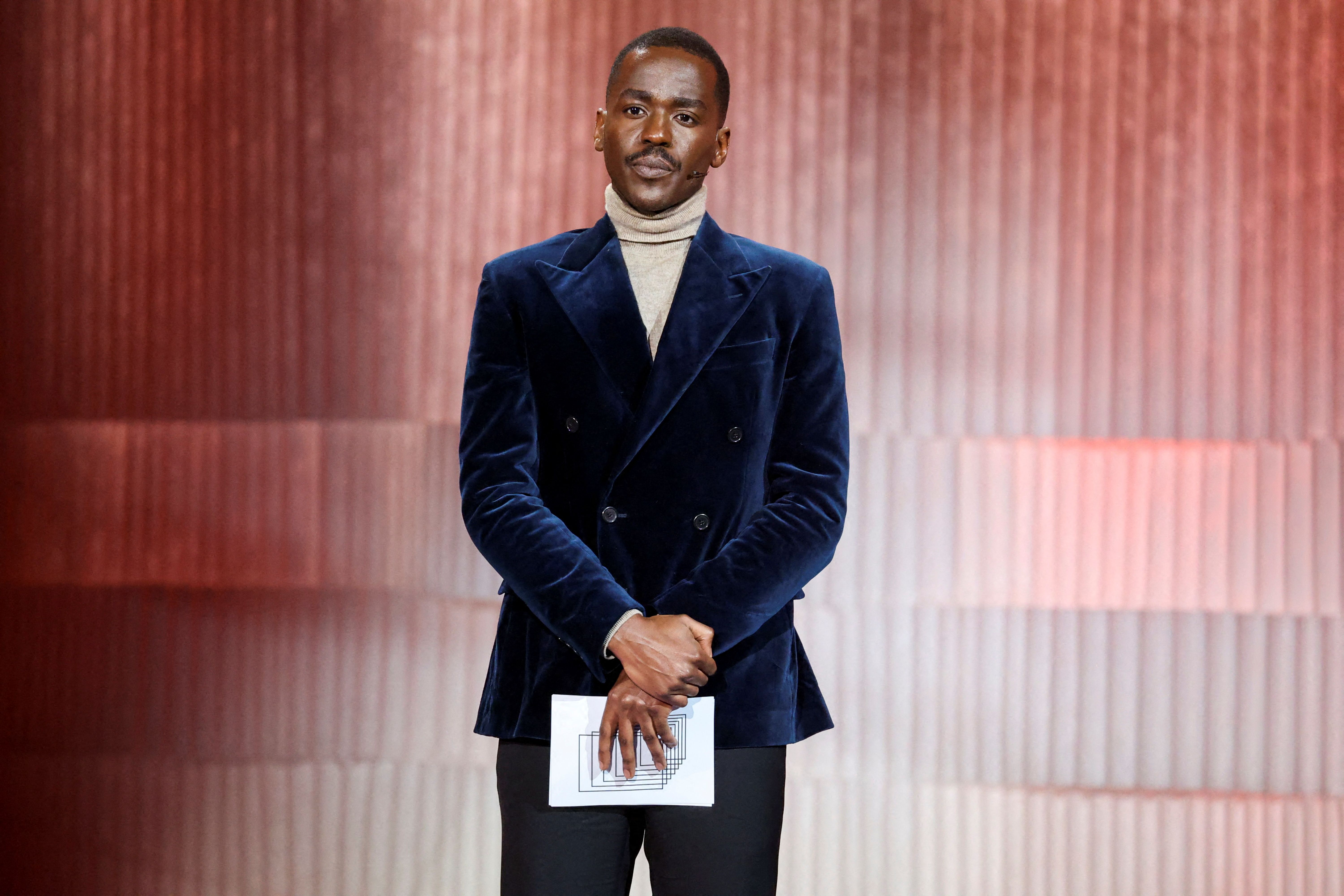 Rwandan-Scottish actor Ncuti Gatwa stands on stage during the 34th European Film Awards ceremony in Berlin on December 11, 2021. | Source: Getty Images