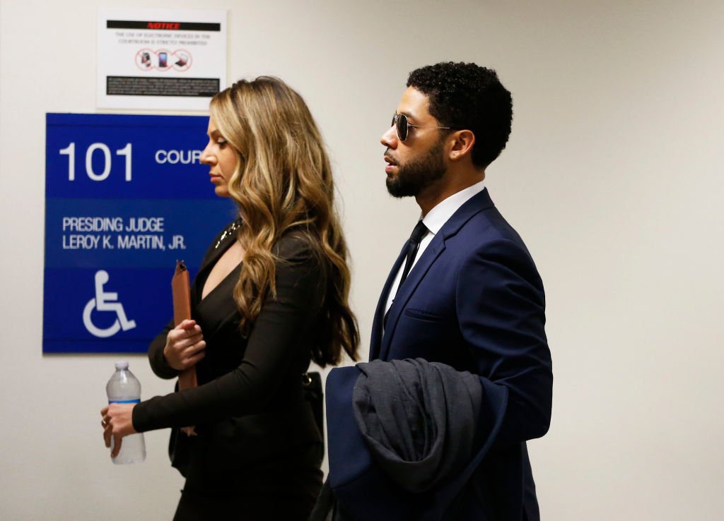 Jussie Smollett (R) and attorney Tina Glandian walk in Leighton Criminal Courthouse for his court appearance  in Chicago, Illinois | Photo: Getty Images