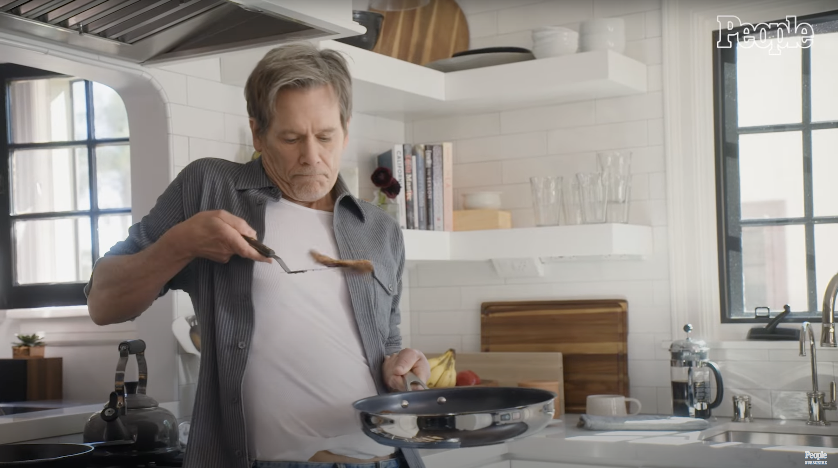 Kevin Bacon showcasing his culinary skills | Source: YouTube/@People