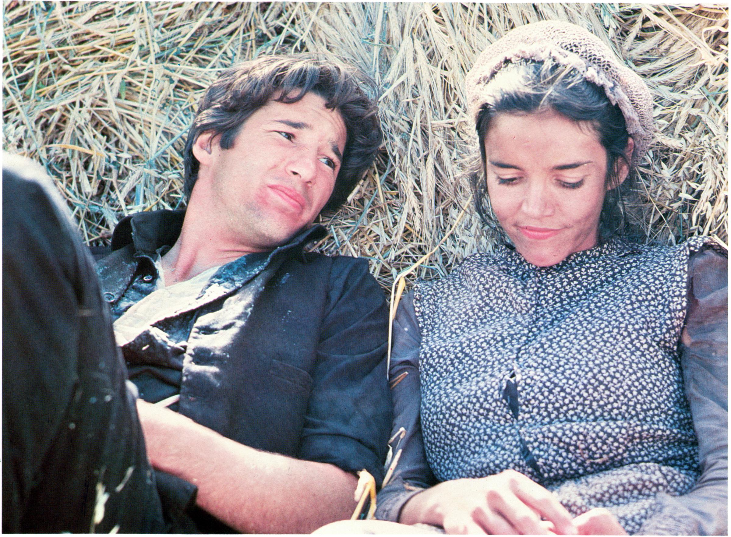 Richard Gere in a scene from "Days of Heaven" with co-star Brooke Adams in 1978. | Source: Getty Images