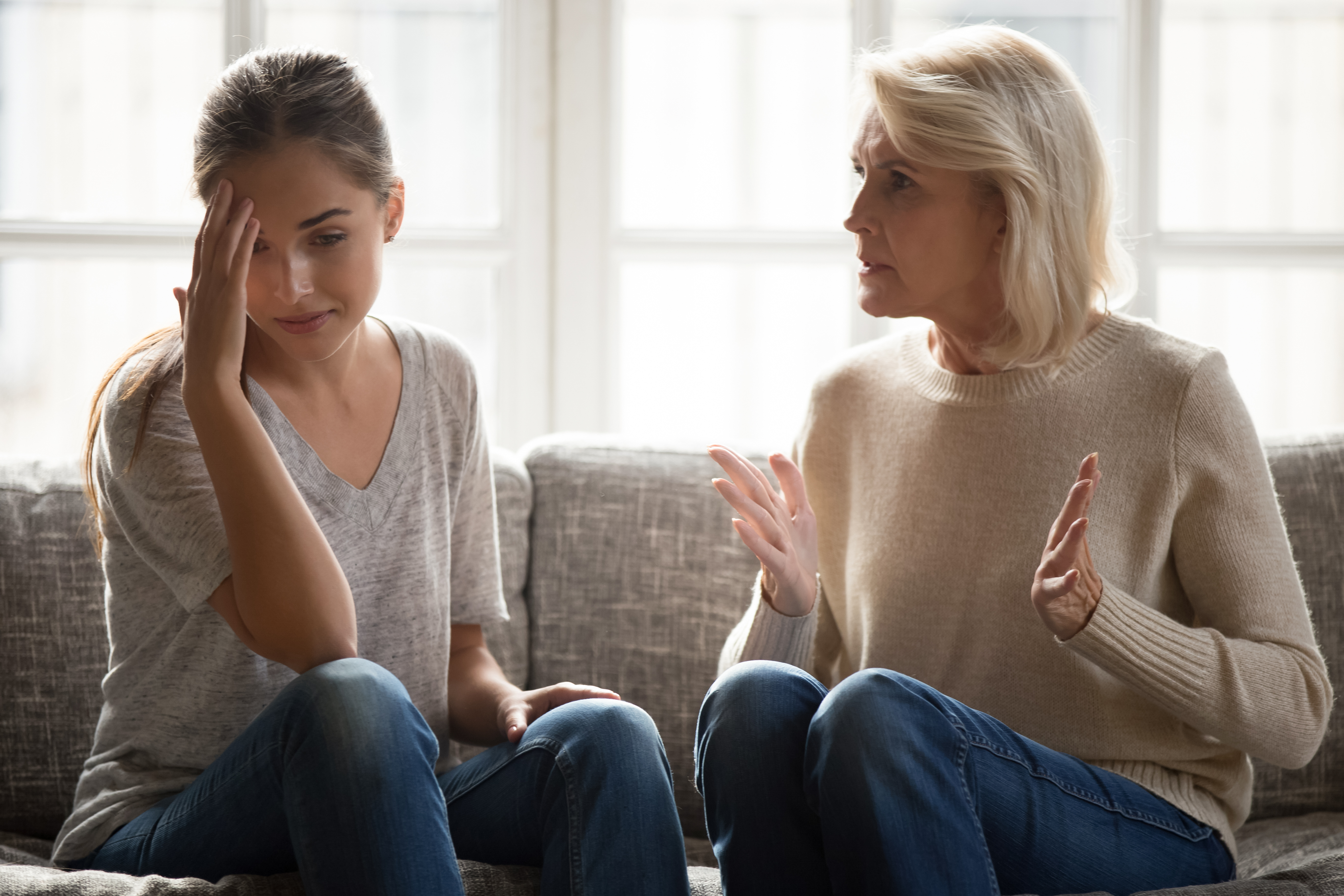 Annoyed middle-aged woman complaining to her daughter | Source: Shutterstock