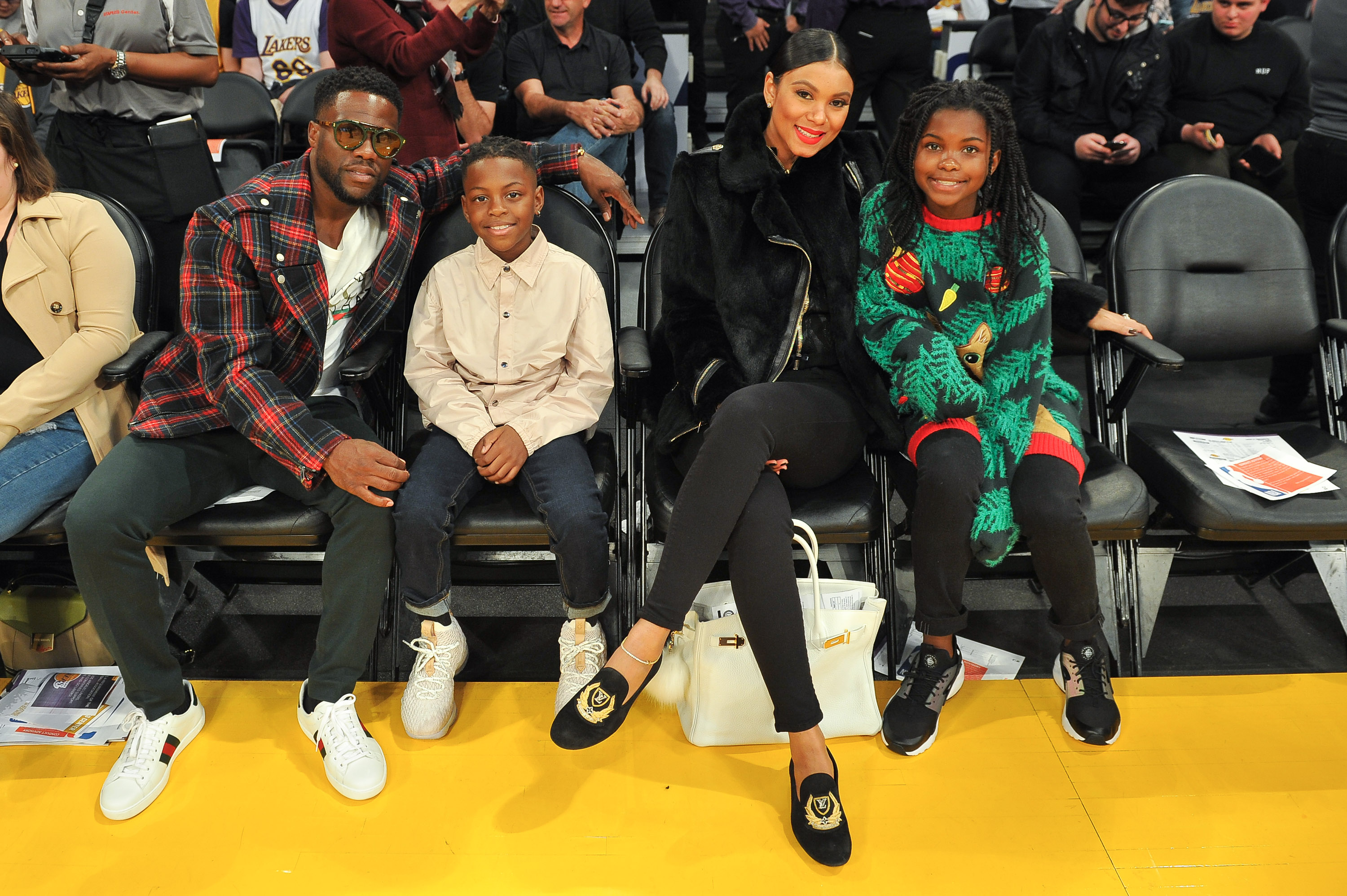 Kevin and Eniko Hart with Hendrix and Heaven Hart attend a basketball game between the Los Angeles Lakers and the Minnesota Timberwolves on December 25, 2017 | Source: Getty Images