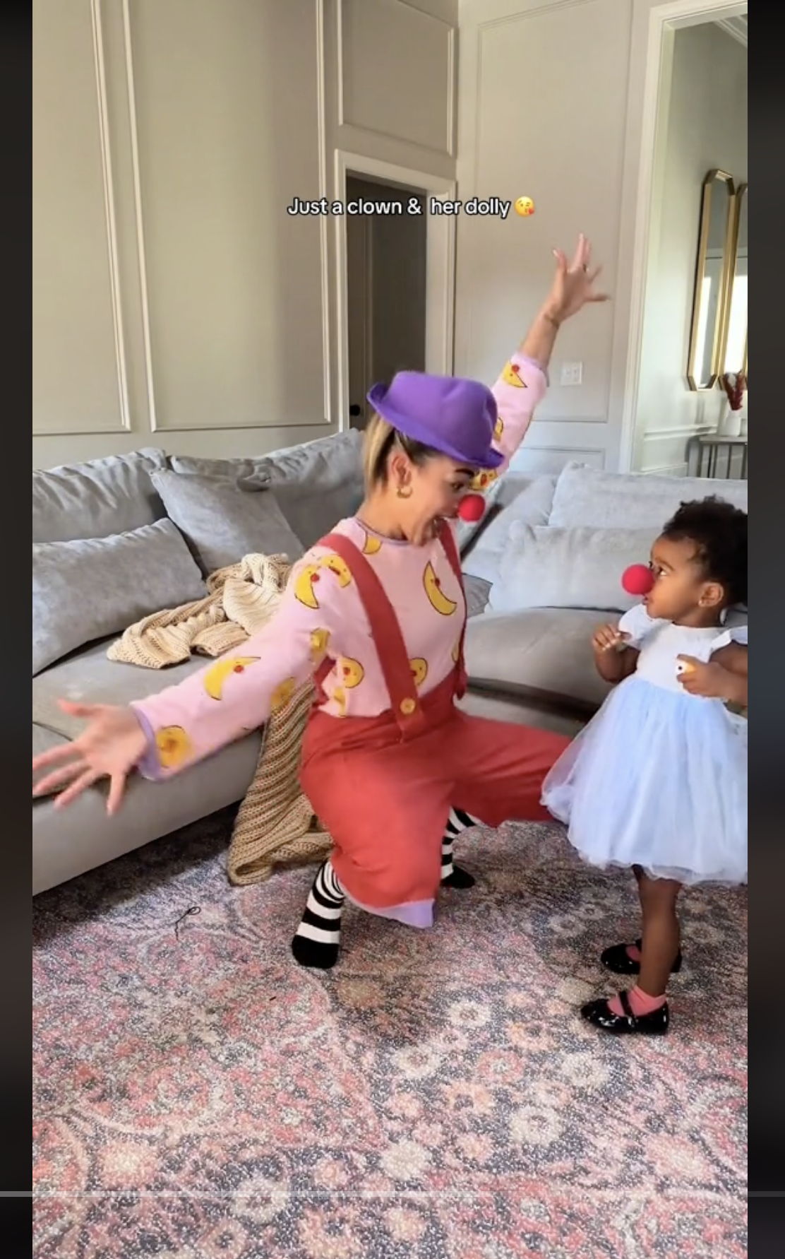Amber Henry and her daughter Ivy Jai dressed as a clown and dolly for Halloween, as seen in a video dated November 1, 2023 | Source: TikTok/amberhenryy