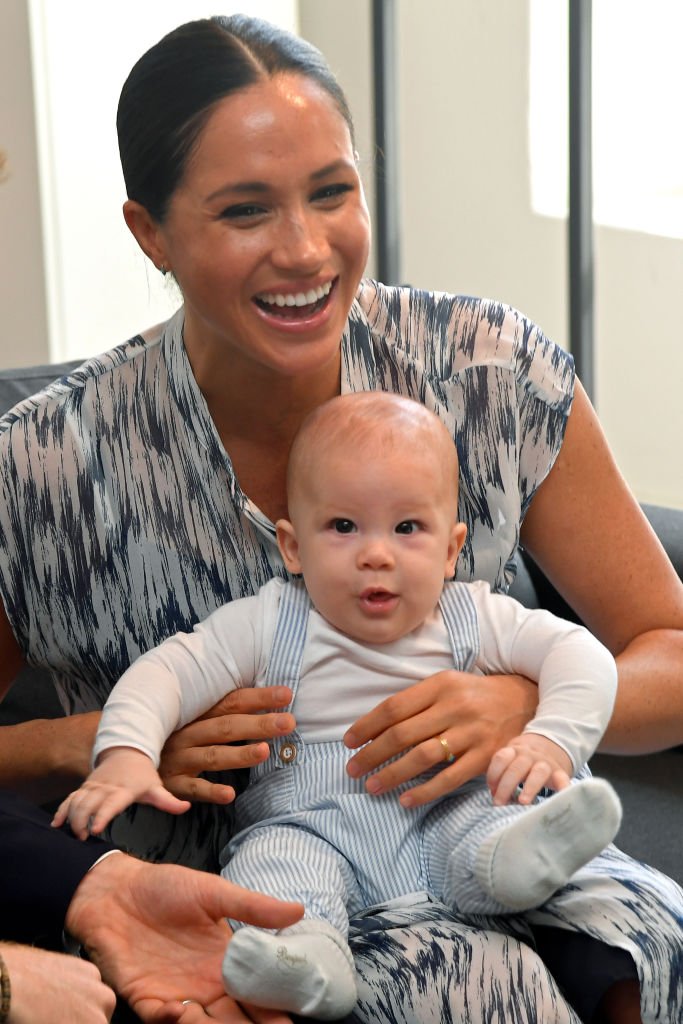 Meghan and baby son Archie Mountbatten-Windsor meet Archbishop Desmond Tutu and his daughter Thandeka Tutu-Gxashe at the Desmond & Leah Tutu Legacy Foundation. | Source: Getty Images