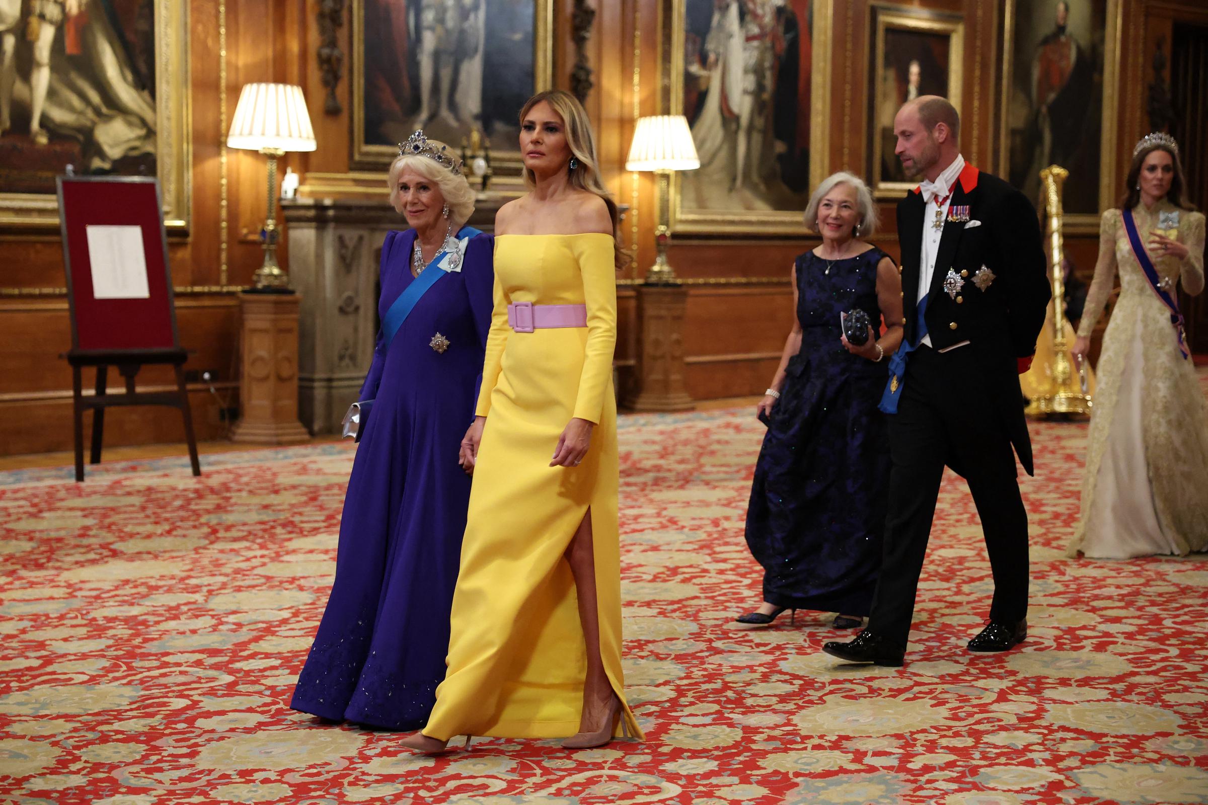 Queen Camilla and Melania Trump walking amid other attendees of the State Banquet, including Prince William and Princess Catherine. | Source: Getty Images