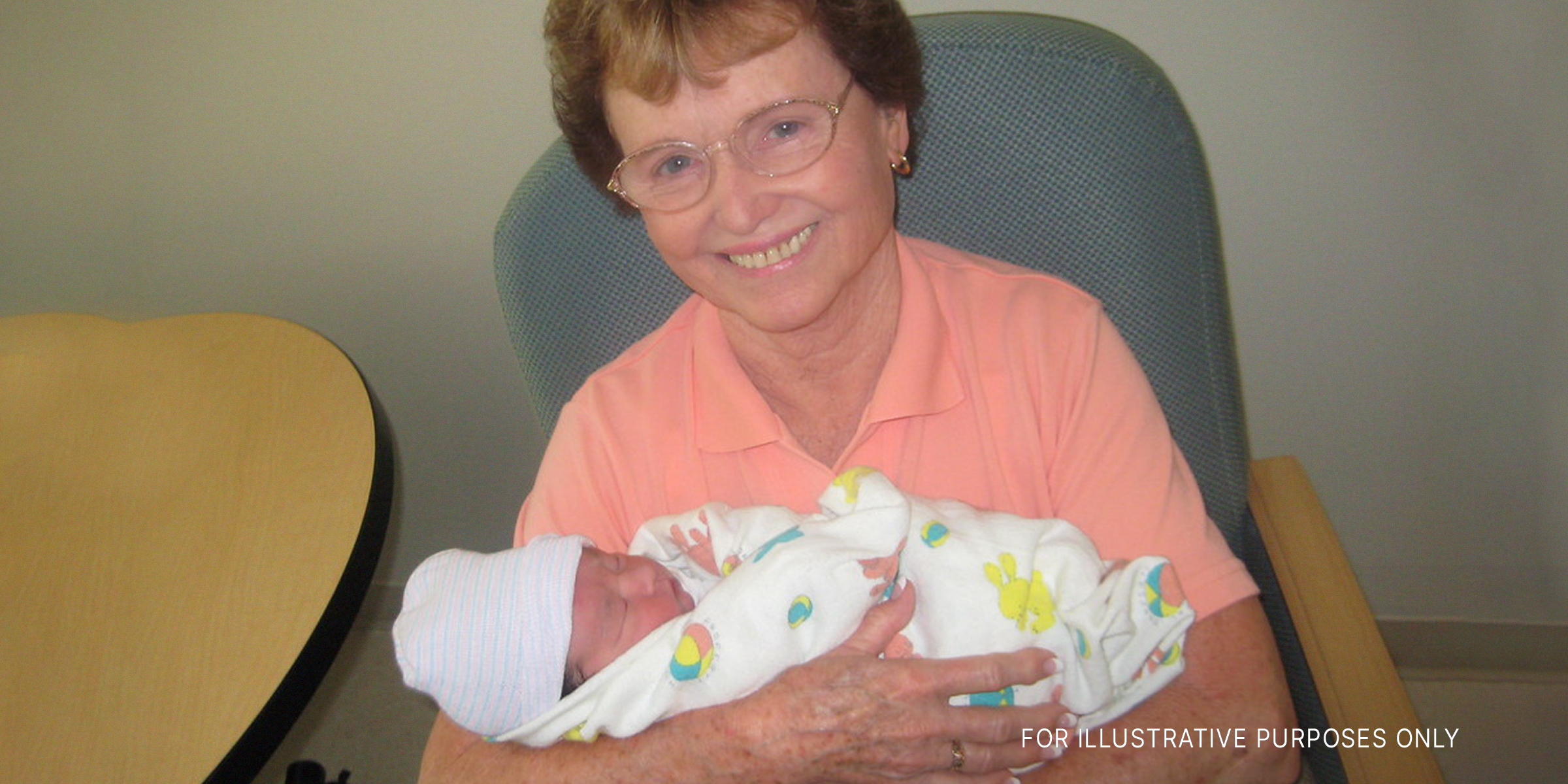 An elderly woman holding a newborn | Source: flickr.com/ryarwood/CC BY-SA 2.0