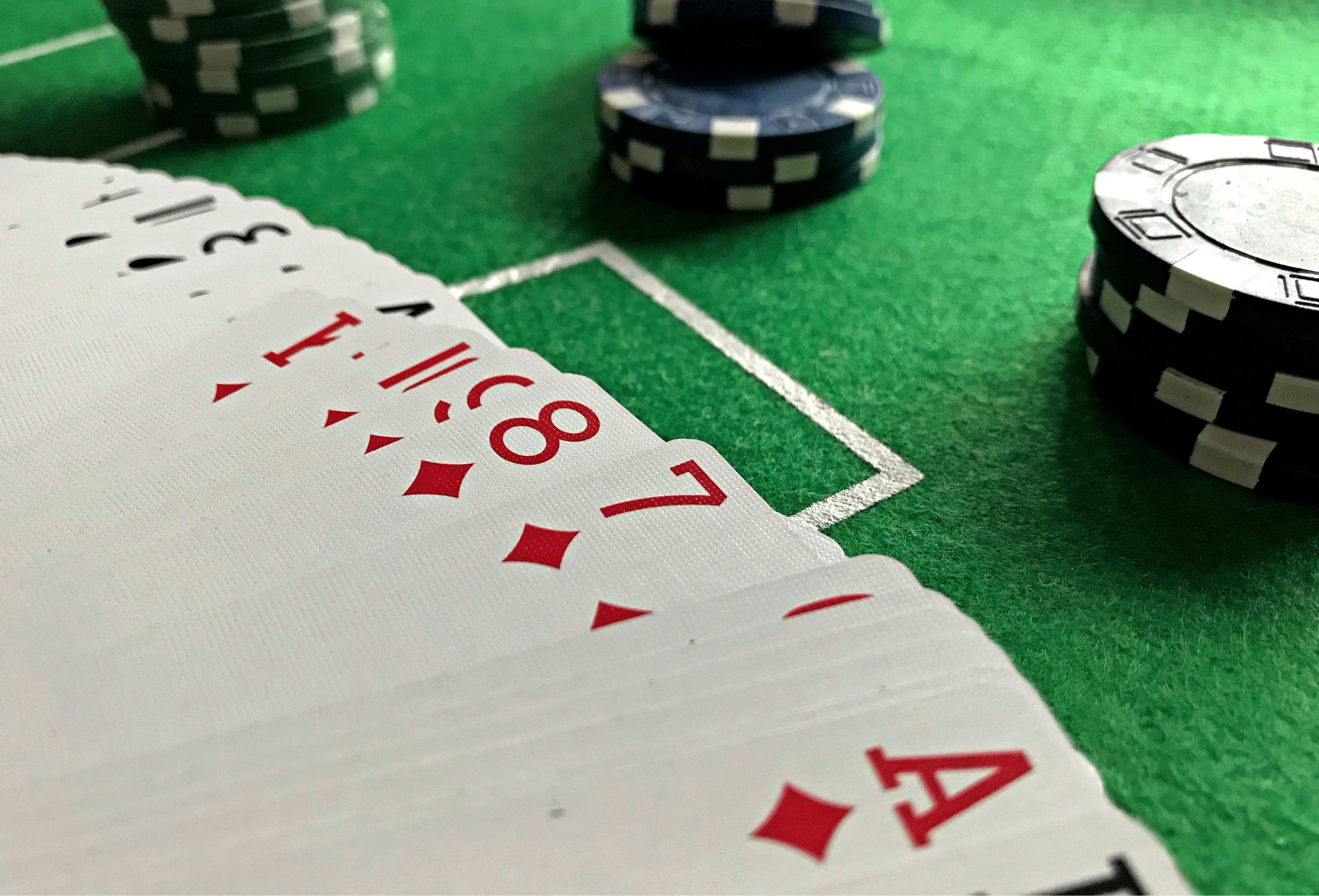 A deck of playing cards with poker chips | Source: Pexels