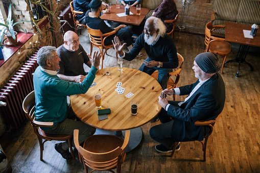 Men hanging out at a bar | Photo: Getty Images