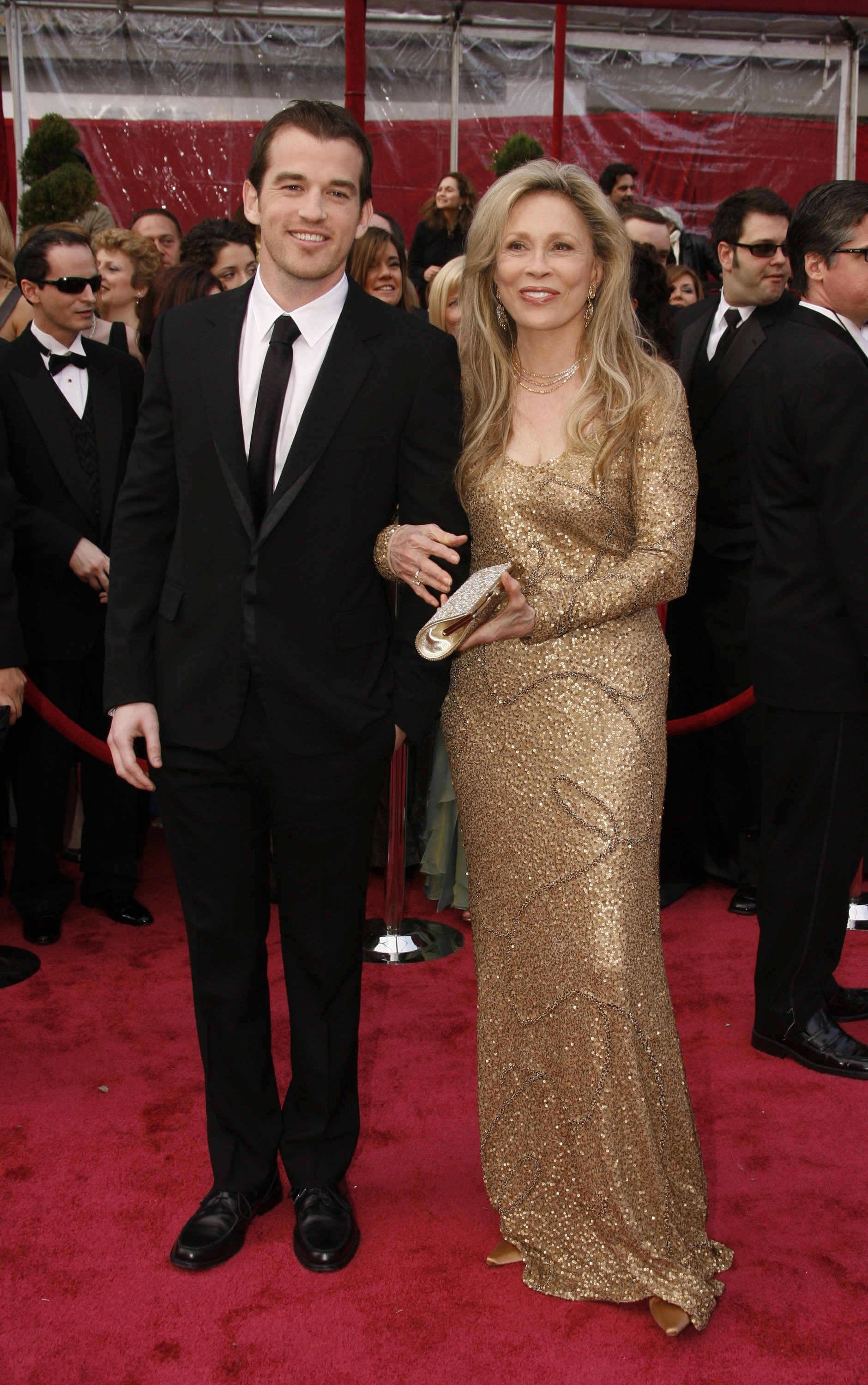 Faye Dunaway and her son Liam O'Neill arrive on the red carpet for The 80th Annual Academy Awards, 2008 in Hollywood, California. | Photo: Getty Images