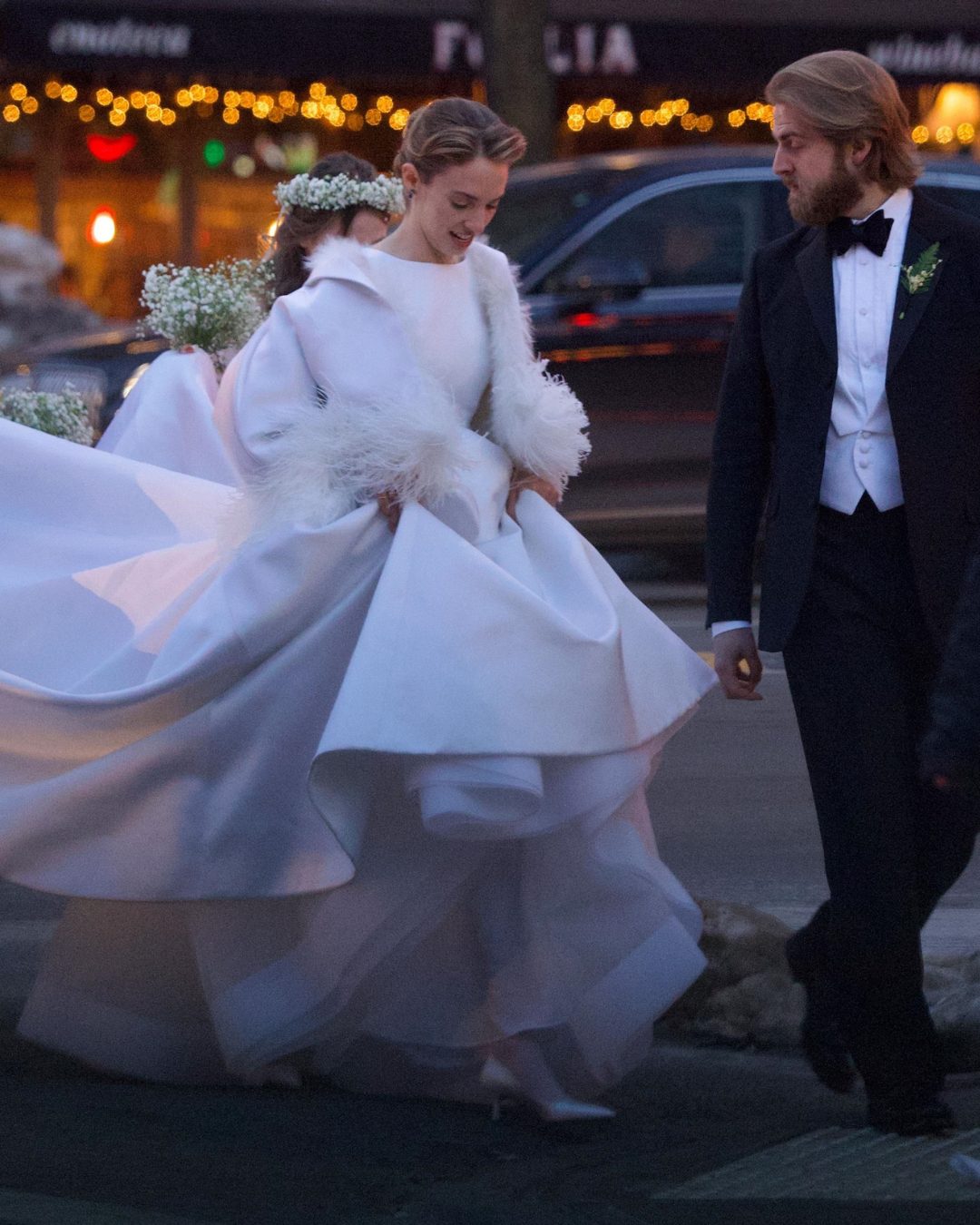 The actress transformed the streets of New York into her personal runway, each step of her gown a soft, sweeping spectacle. Lifting the voluminous skirt with quiet elegance, she let the feathered sleeves sway gently with every movement. Her smile was serene, her posture effortless — a modern bride making a powerful statement: that style can be dramatic, romantic, and entirely her own. | Source: Instagram/pagesix