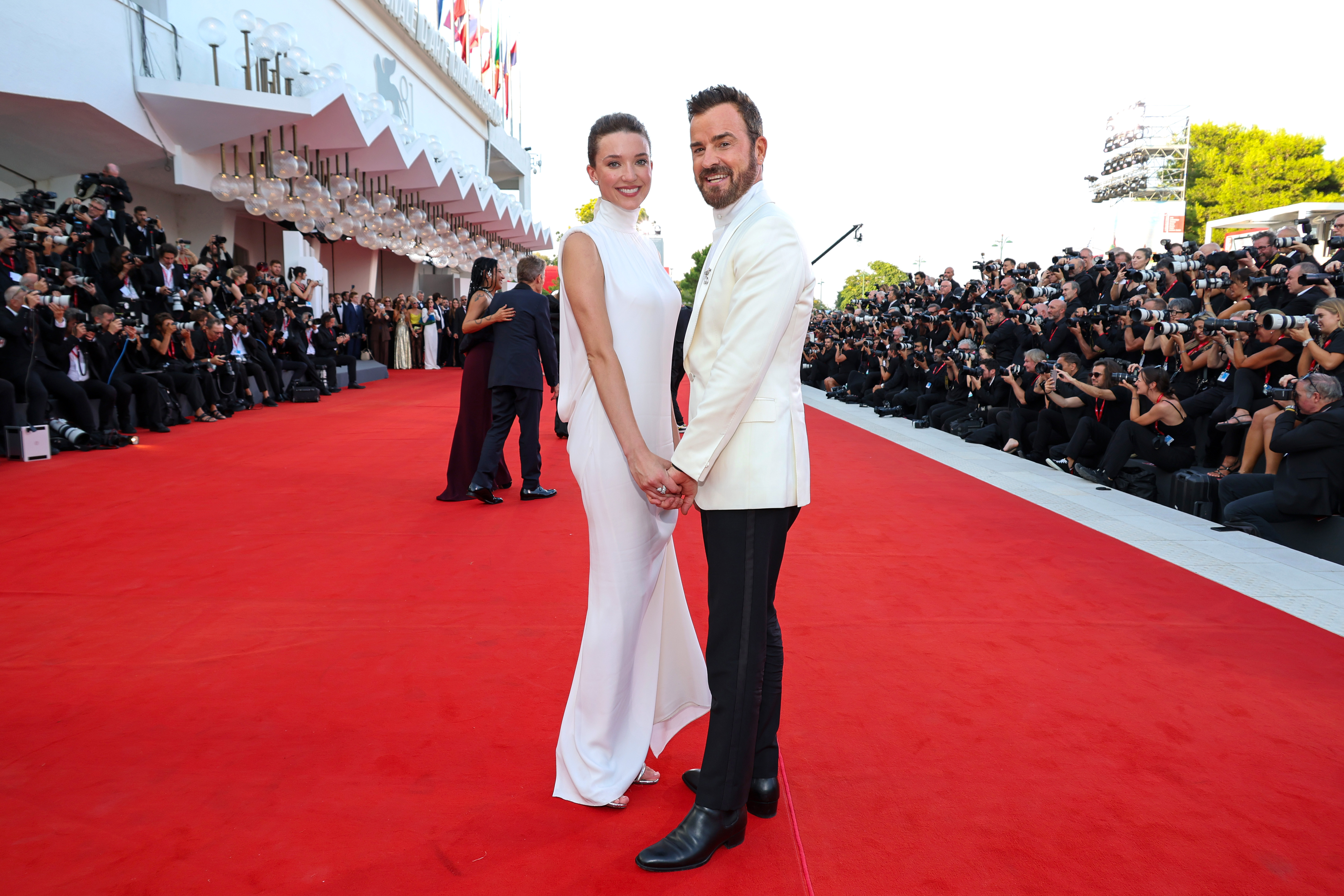 Nicole Brydon Bloom and Justin Theroux hold hands at the red carpet for the premiere of "Beetlejuice Beetlejuice" during the 81st Venice International Film Festival on August 28, 2024 in Italy | Source: Getty Images