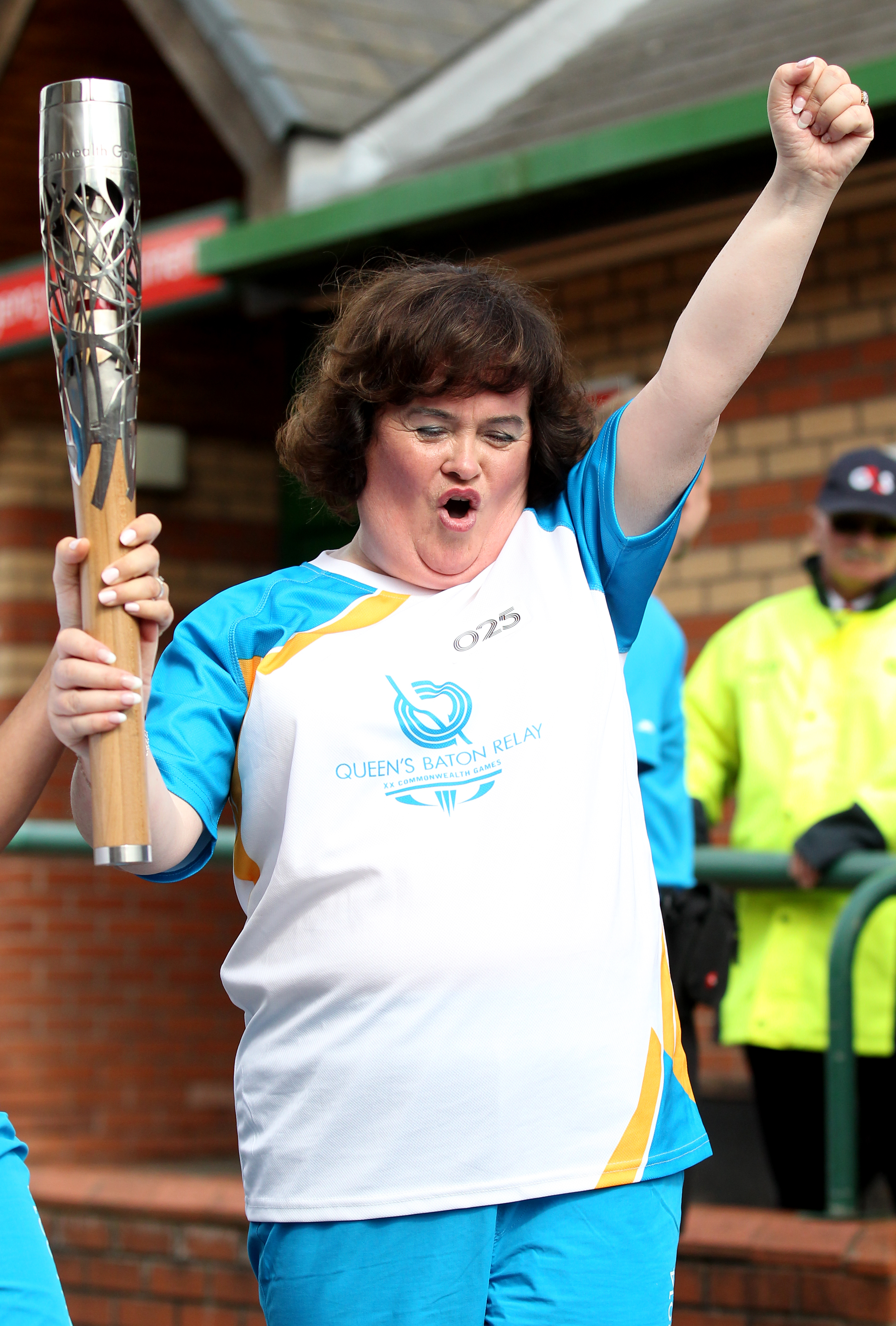 Susan Boyle carries the Glasgow 2014 Queen's Baton on July 21, 2014 in Scotland | Source: Getty Images
