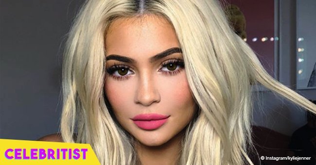 Kylie Jenner snuggles with daughter while getting her makeup done in new photos