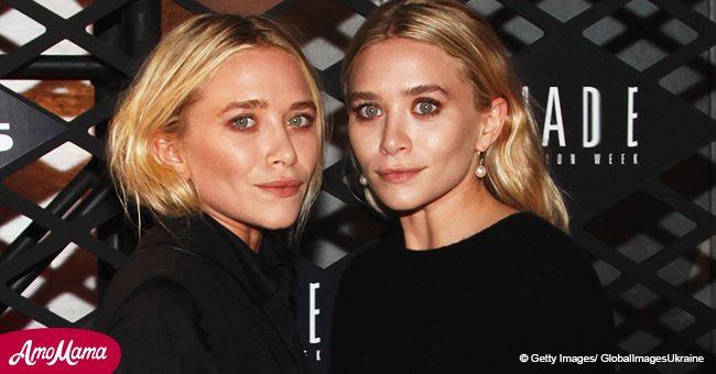 Mary-Kate and Ashley Olsen step out in matching outfits and large necklaces at the red carpet
