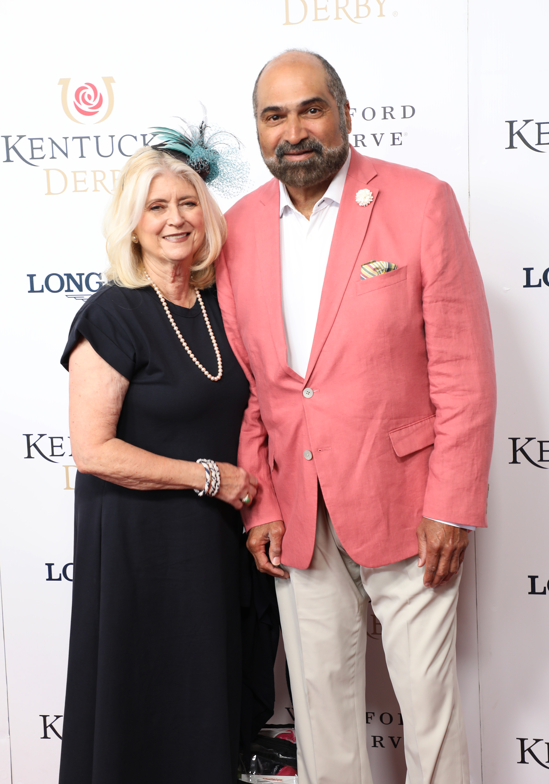 Dana Dokmanovich and Franco Harris walk the red carpet at the 148th Kentucky Derby on May 7, 2022, at Churchill Downs in Louisville, Kentucky. | Source: Getty Images