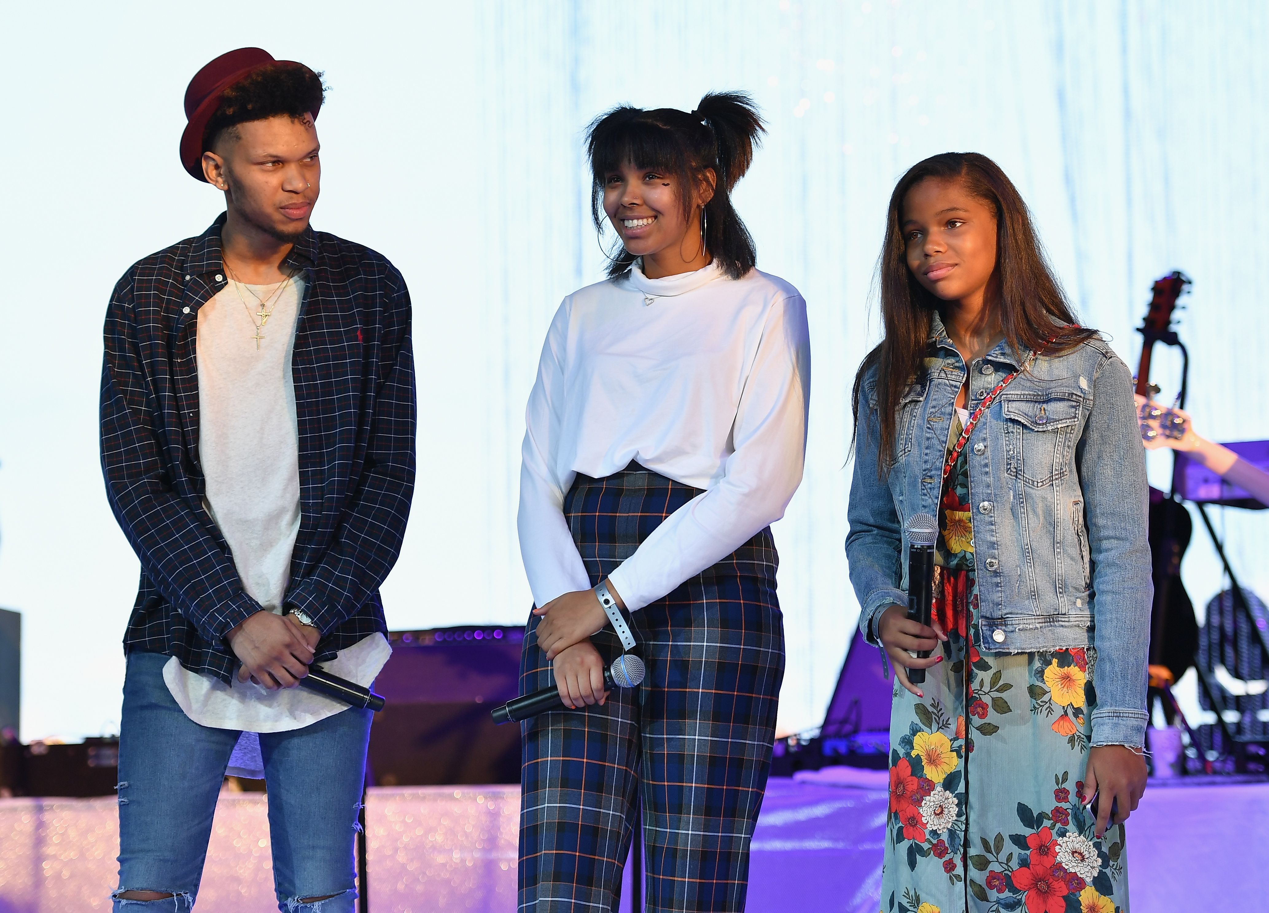Grandchildren of Aretha Franklin, Jonah, Victorie and Gracie on stage at the "A People's Tribute to the Queen" event on August 30, 2018 in Detroit, Michigan | Source: Getty Images