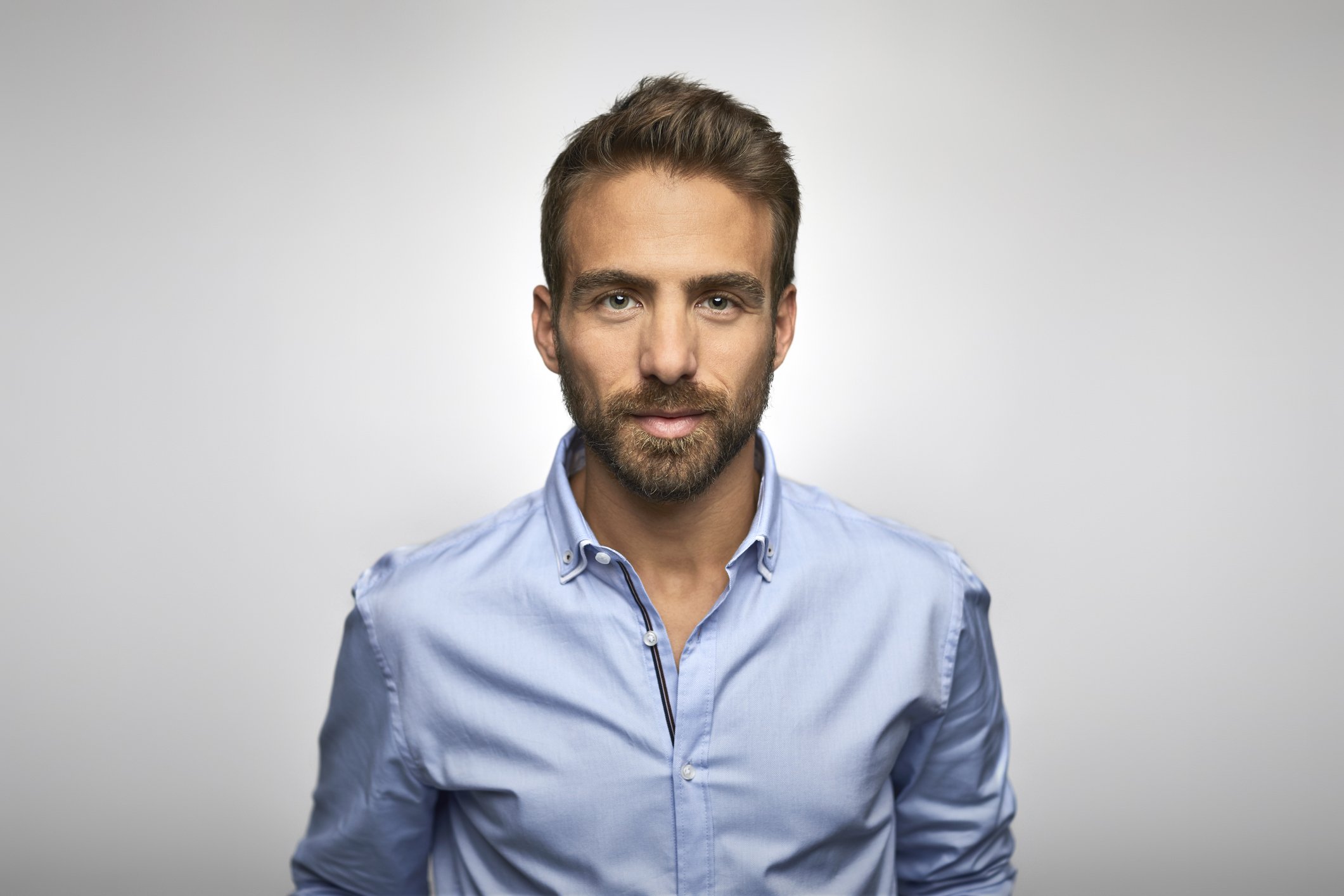 Portrait of a young man in a blue shirt. | Photo: Getty Images