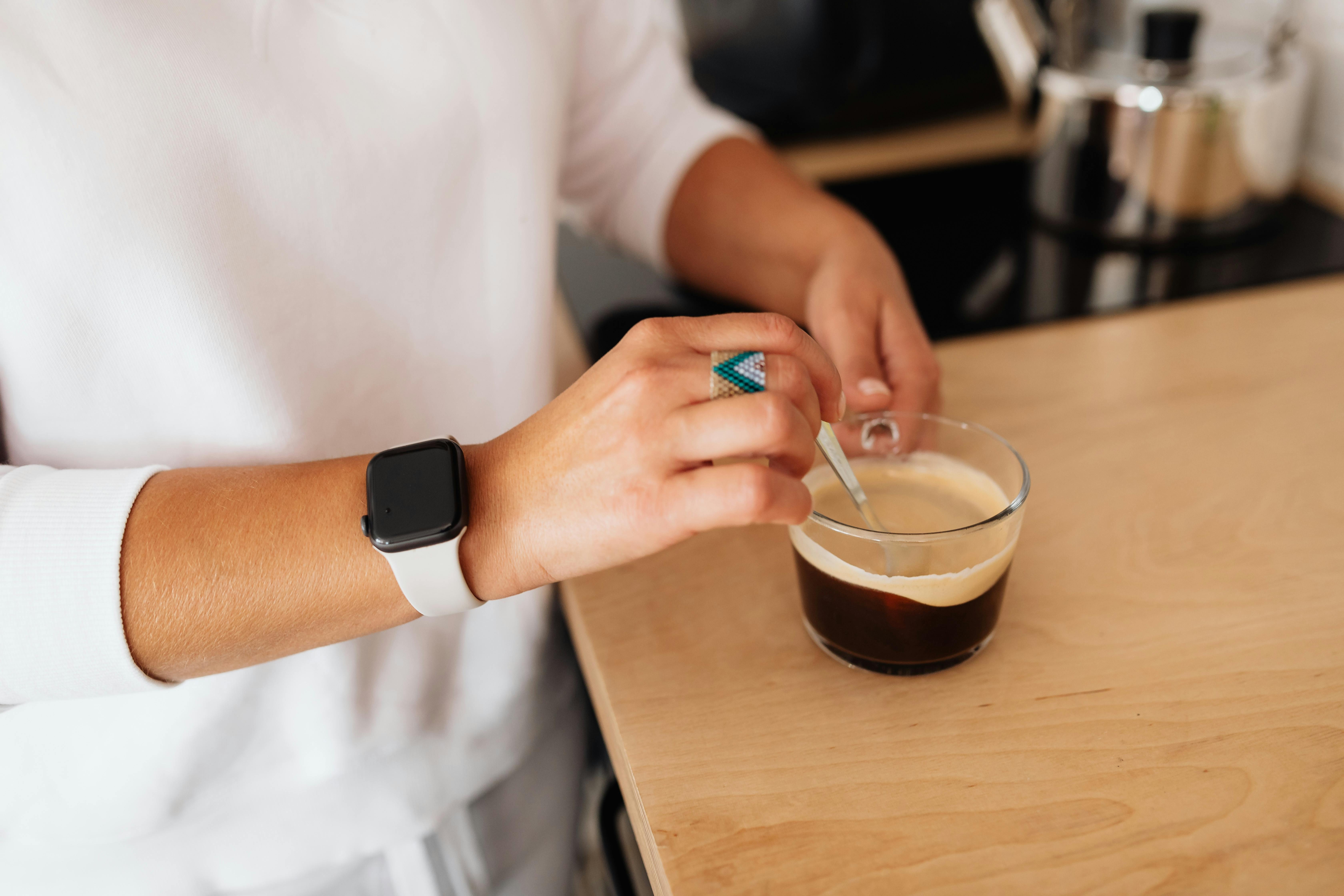 A person stirring coffee | Source: Pexels