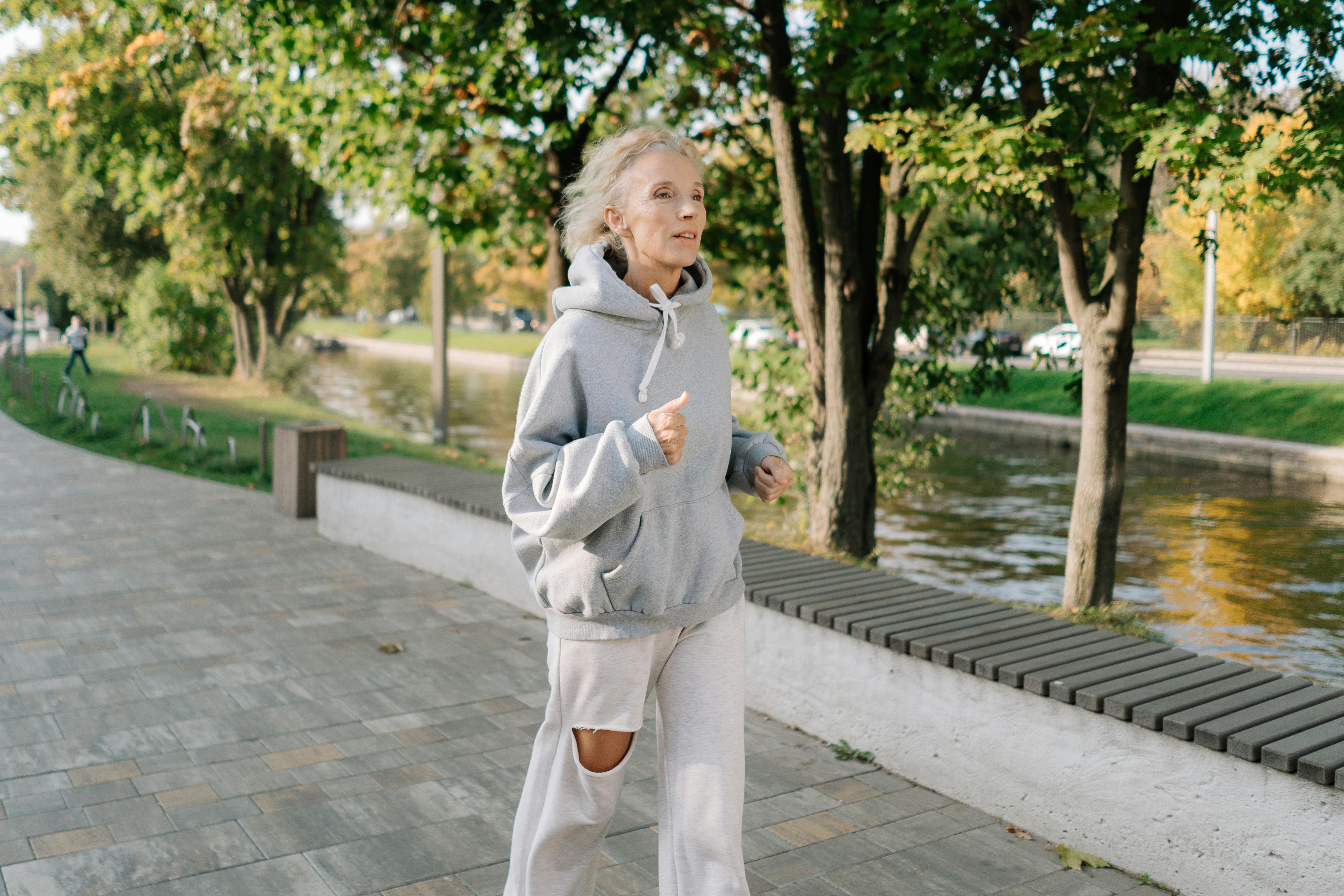 An elderly woman jogging | Source: Pexels