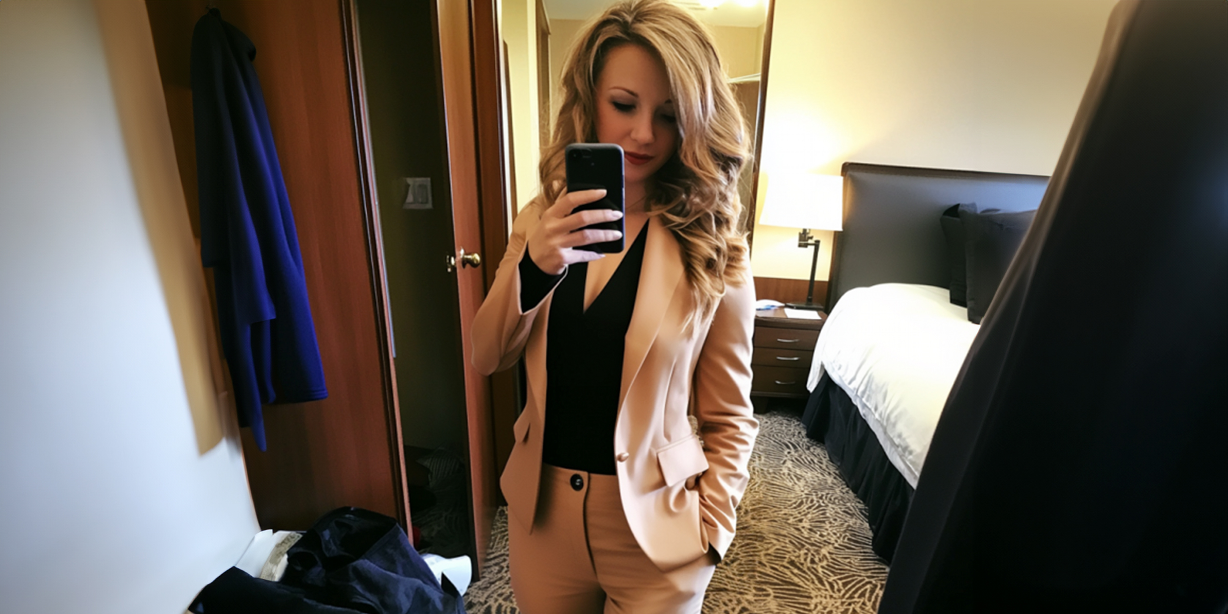 Woman taking a photo in a hotel room | Source: Midjourney