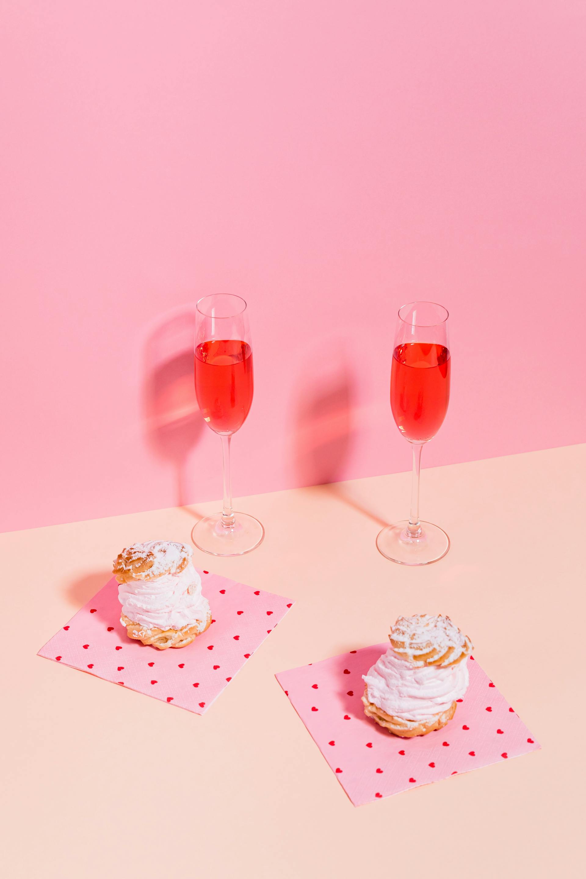 Pastries with cream and champagne flutes on a table | Source: Pexels