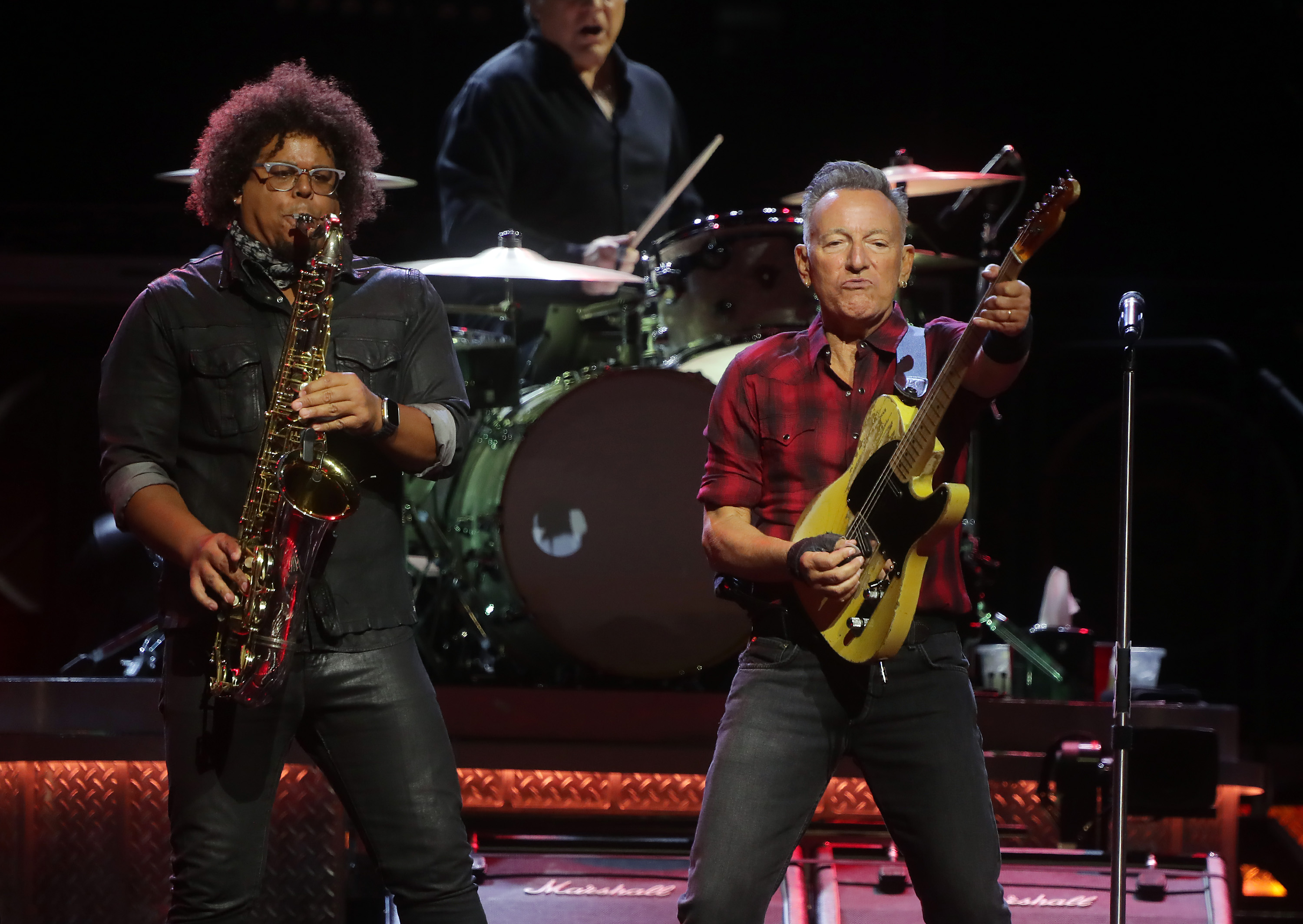 Jake Clemons and Bruce Springsteen performing at Footprint Center on March 19, 2024 in Phoenix, Arizona. | Source: Getty Images