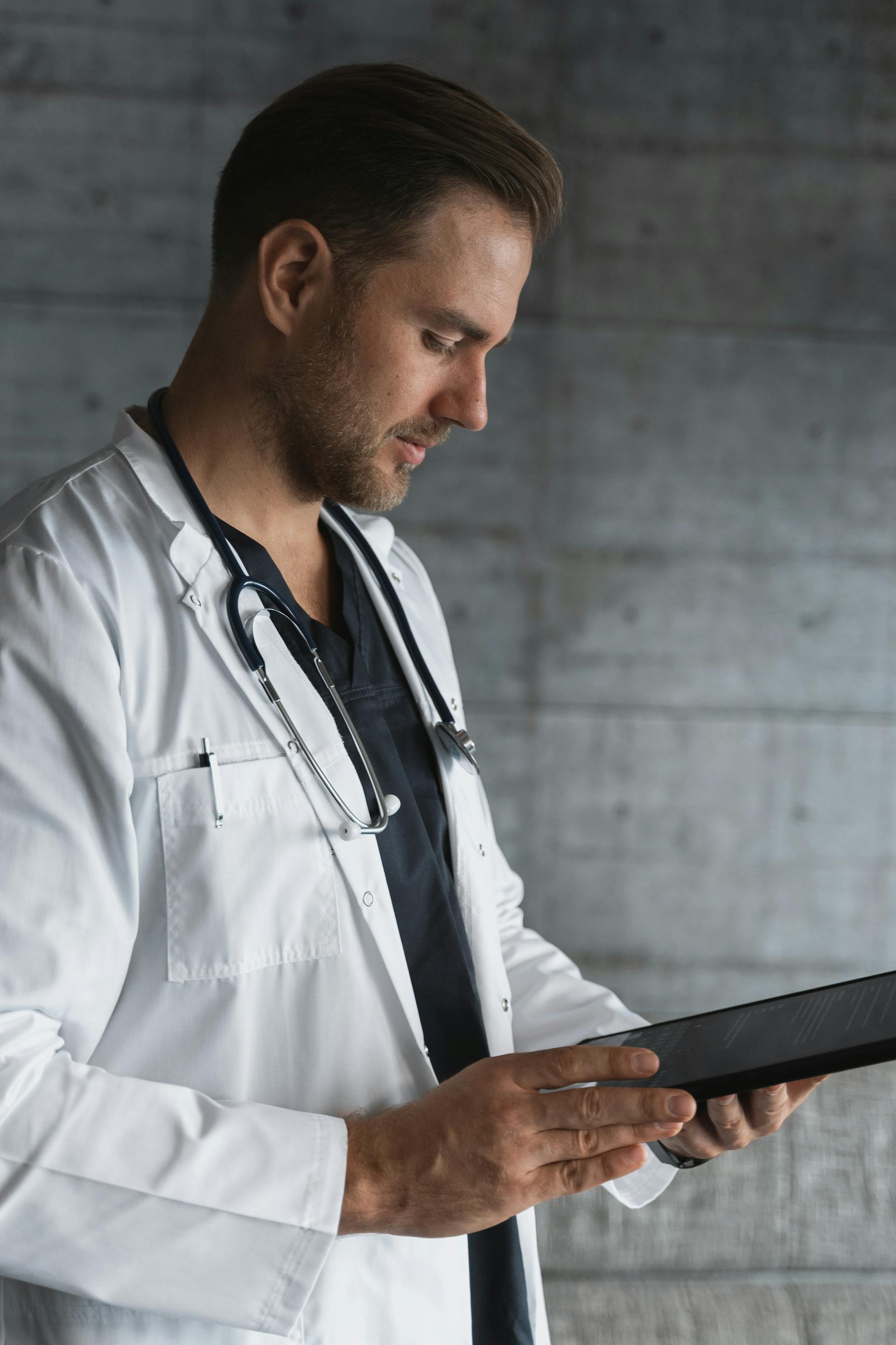 A doctor checking his notes | Source: Pexels