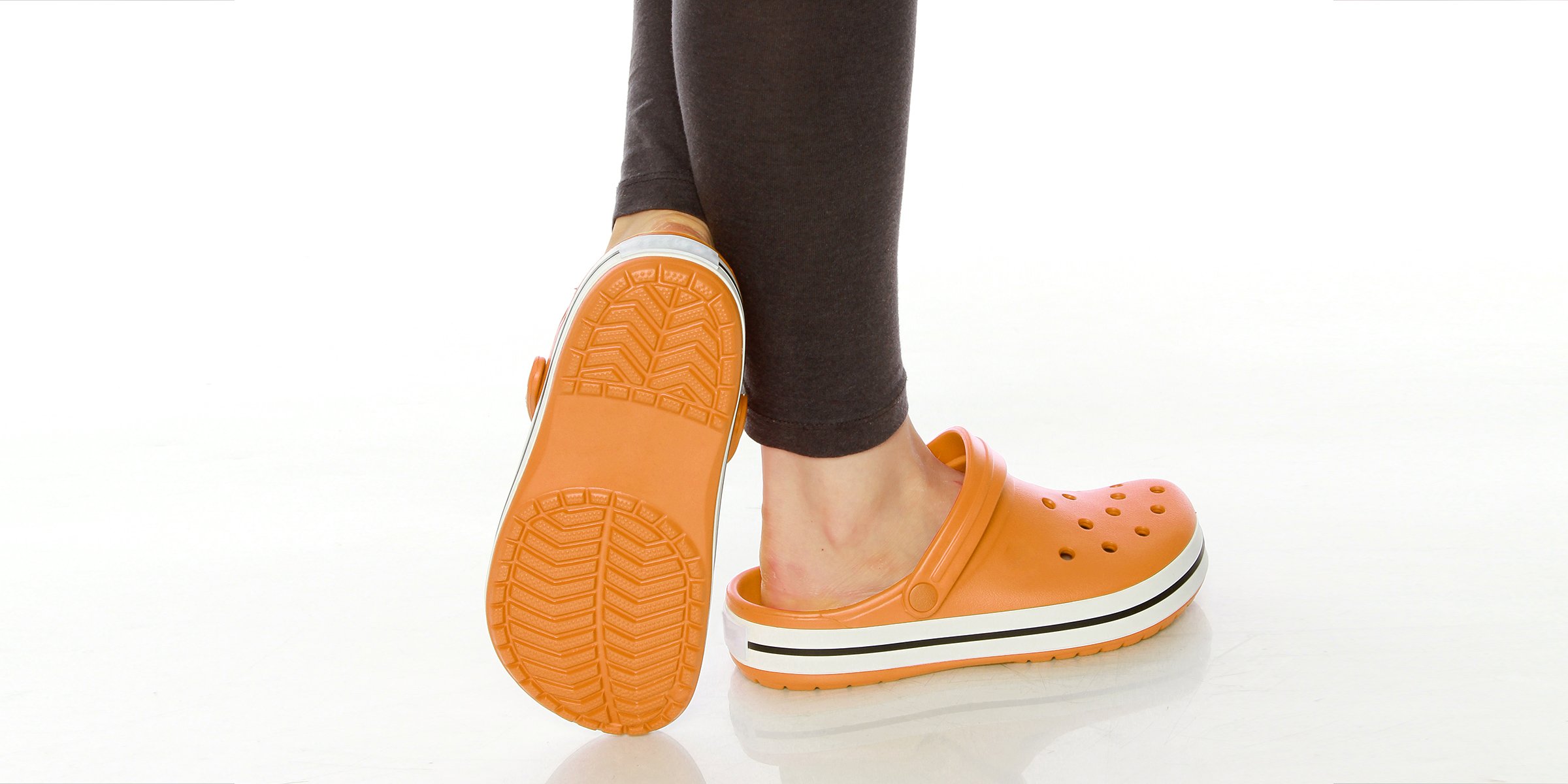 Person wearing a pair of crocs | Source: Shutterstock