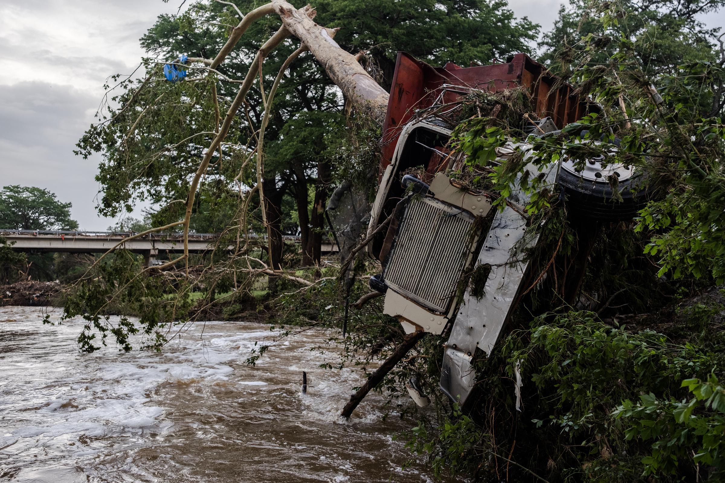 A large truck is impaled onto a tree after flash flooding on the bank Guadalupe River on July 5, 2025 in Center Point, Texas. | Source: Getty Images